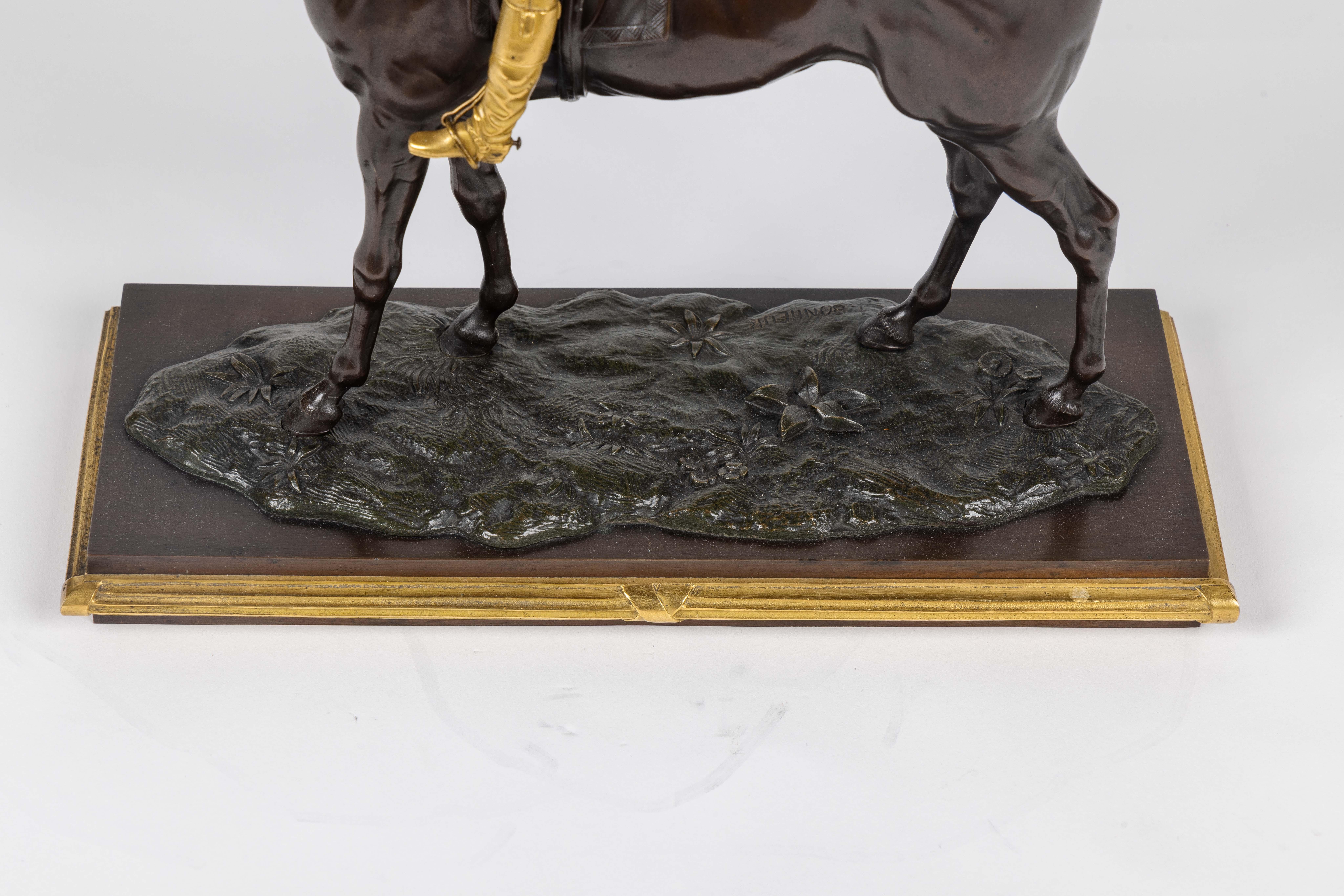 Isidore-Jules Bonheur (French, 1827–1901)

 A Rare Gilt and Patinated Bronze Jockey on A Horse, circa 1875.

Introducing a truly exceptional and highly sought-after piece, a rare gilt and patinated bronze sculpture titled 