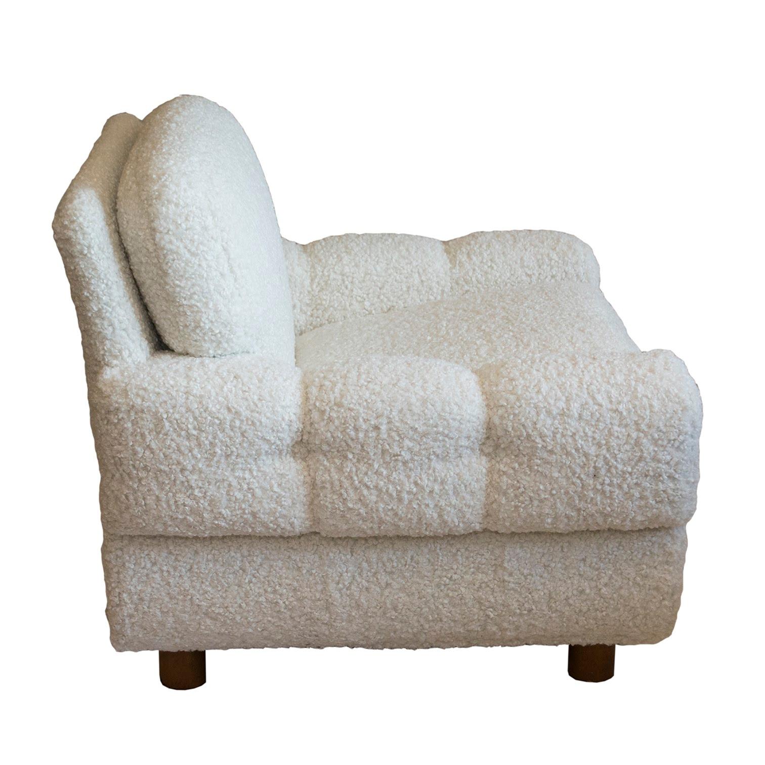 The look of these chairs is reminiscent of Paul Frankl's station wagon series. The oversized arms give these chairs their unique character. The faux shearling marries well with the Scandinavian design. An interesting element is the unique system of