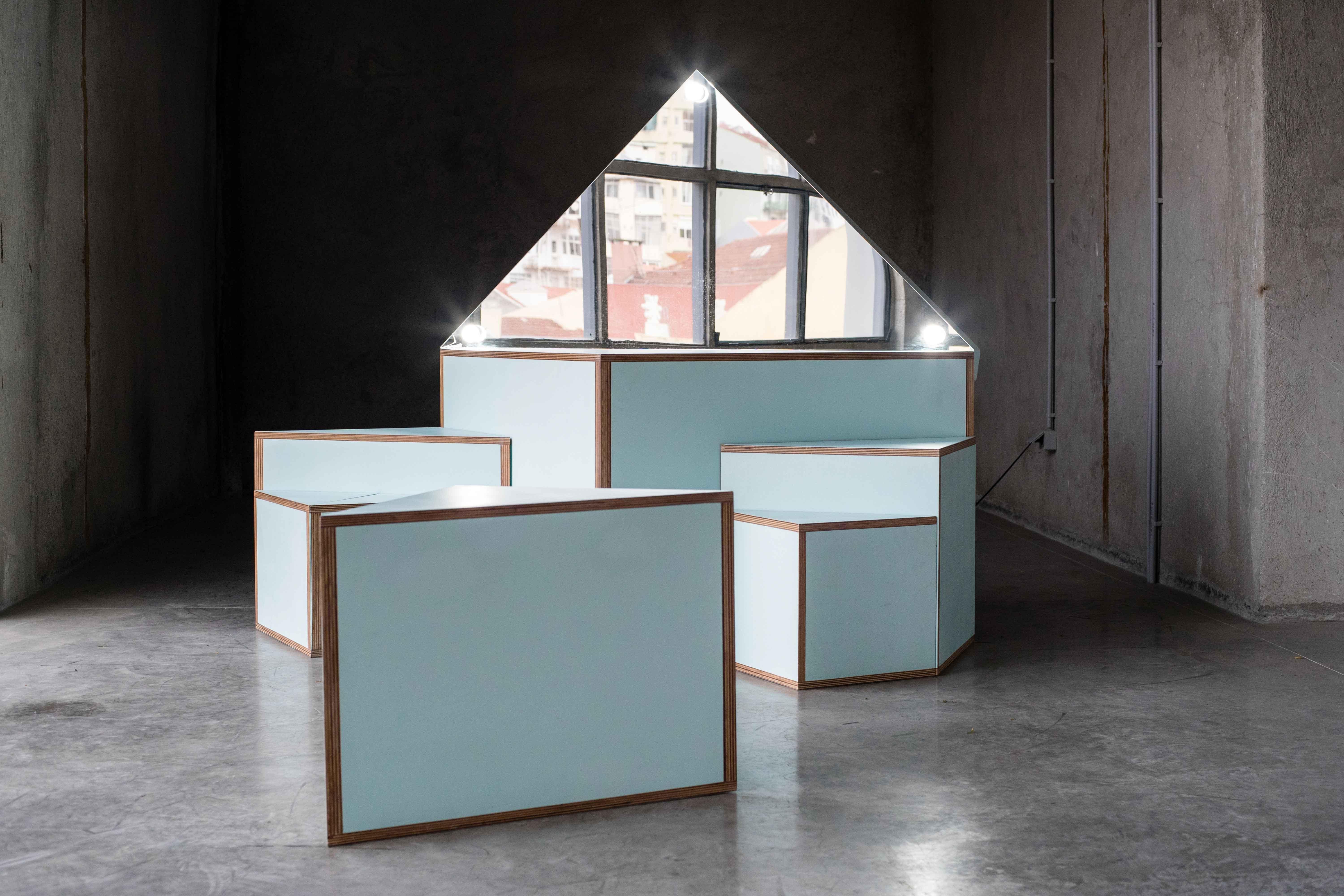 Isla dressing table by MOB 
Limited editions of 5 + 1 prototype
Designer: Ivan Navaro and Courtney Smith (USA)
Dimensions: H 154 x D 76 x W 154cm
Material: Birch plywood, mirror, white coated light bulb

This sculpture is a dressing
