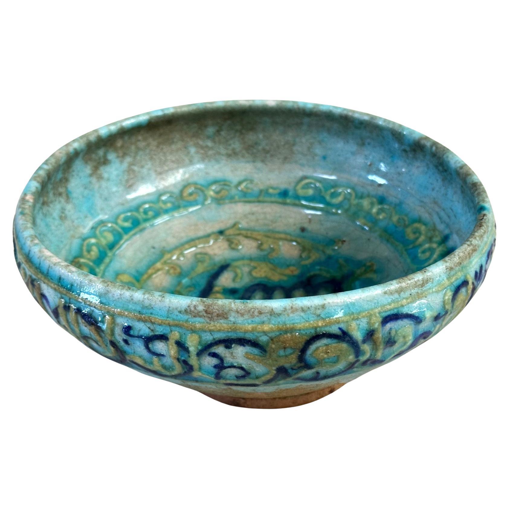 Islamic Glazed Ceramic Bowl with Relief Inscription  For Sale