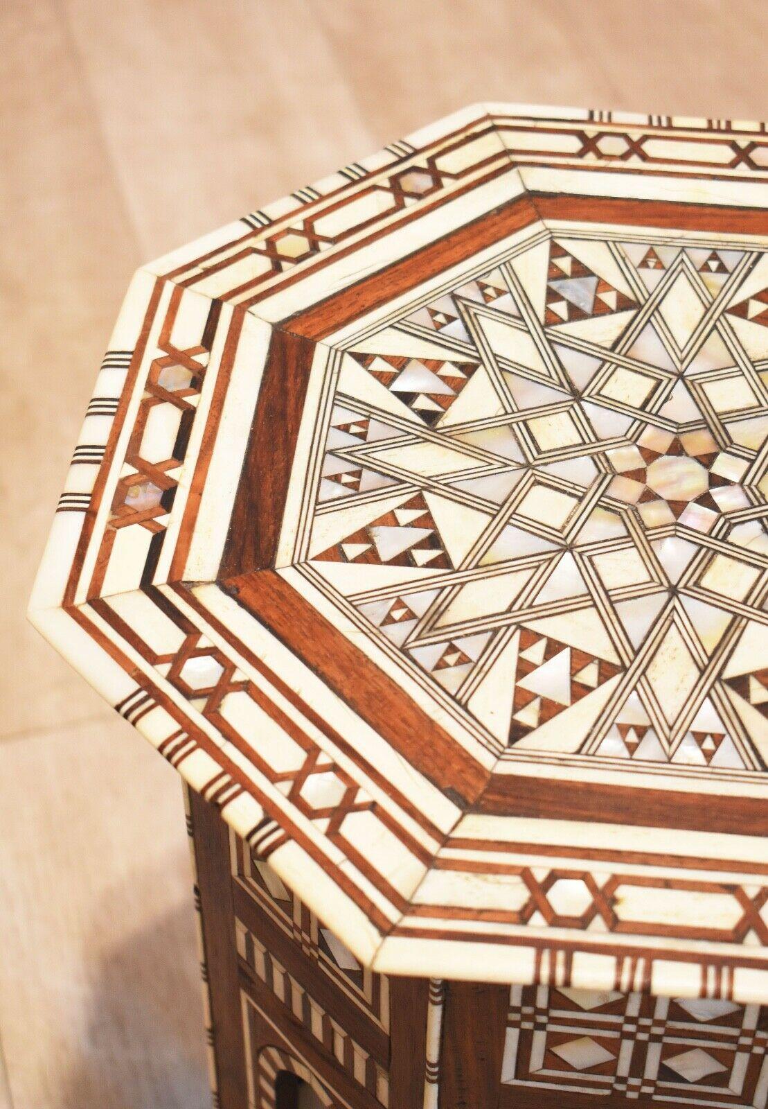 A stunning Islamic side table or hexagonal form. This table has a geometrically intricate design of mother pearl and bone inlay. 

Superb example of its type, especially rare and fine. 

  

   