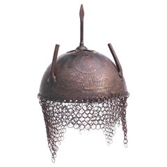 Used Islamic Persian iron helmet with chainmail. Engraved with Elephants