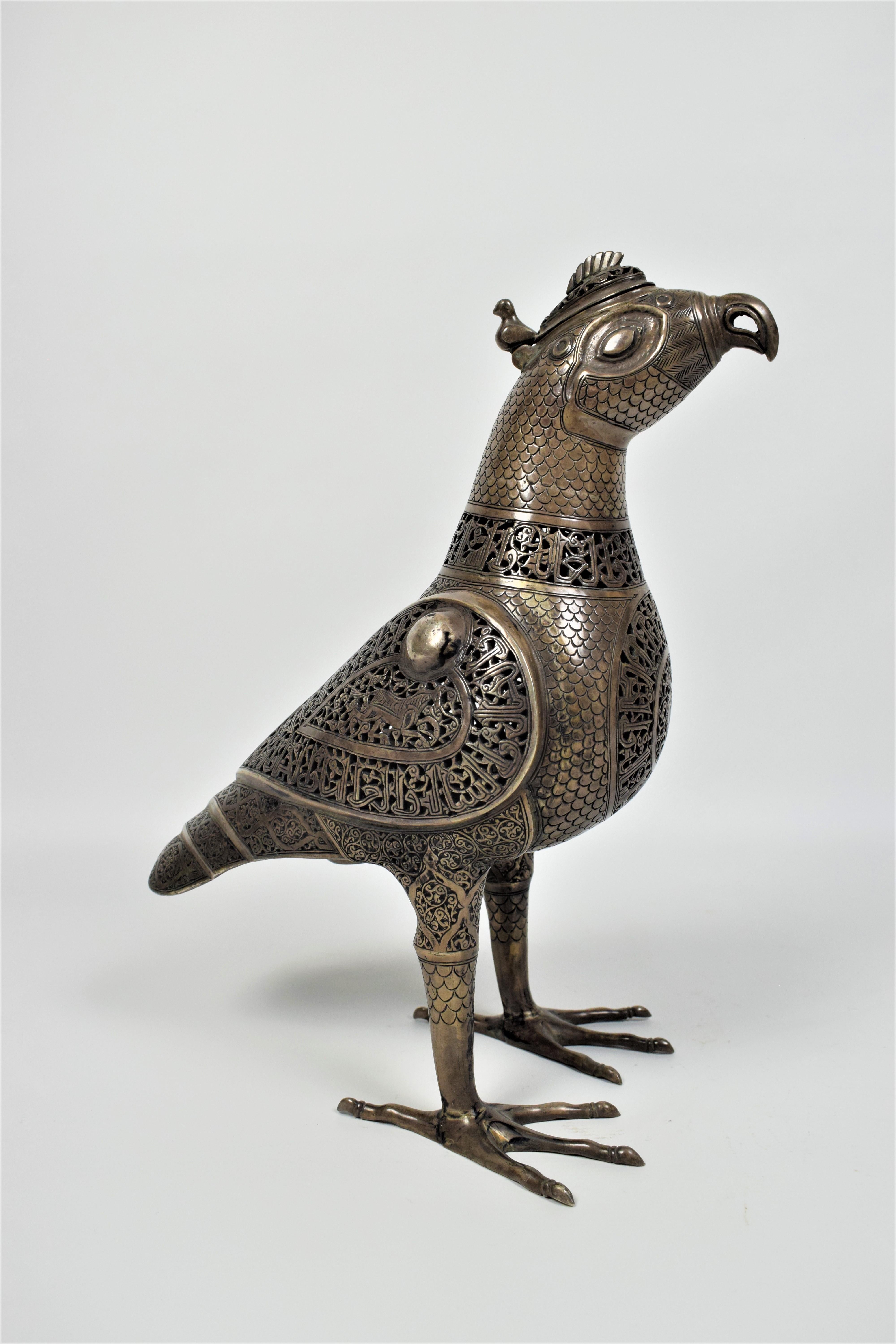 Islamic Silver bird incense Burner, 92% silver, 18th-19th century

An archaistic Islamic incense burner in the shape of a standing bird with extended claws. The bird is prevalent with openwork arabesque ornament designs to the chest, wings, neck
