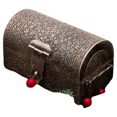 Islamic-style silver chest jewelry box with floral embossing and hinged handles Islamic-style silver chest jewelry box with floral embossing and hinged handles