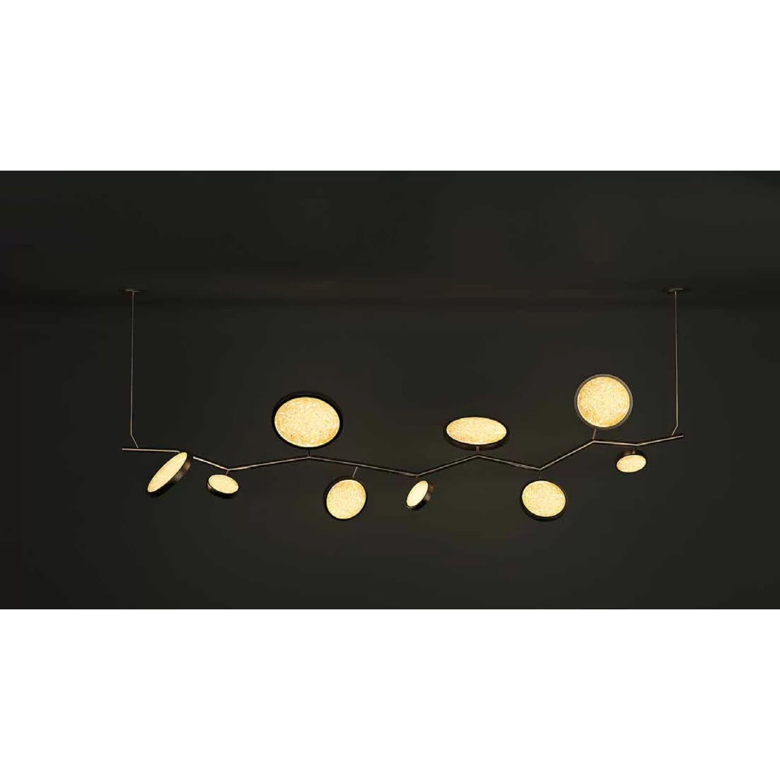 Island Circles Black Brass Pendant Lamp by Dainte
Dimensions: W 200.5 x H 76 cm.
Materials: Glass and blackened brass. 

Also available in natural brass finish. Please contact us.

An extraordinary Island Pendant Circles, featuring ten circles,