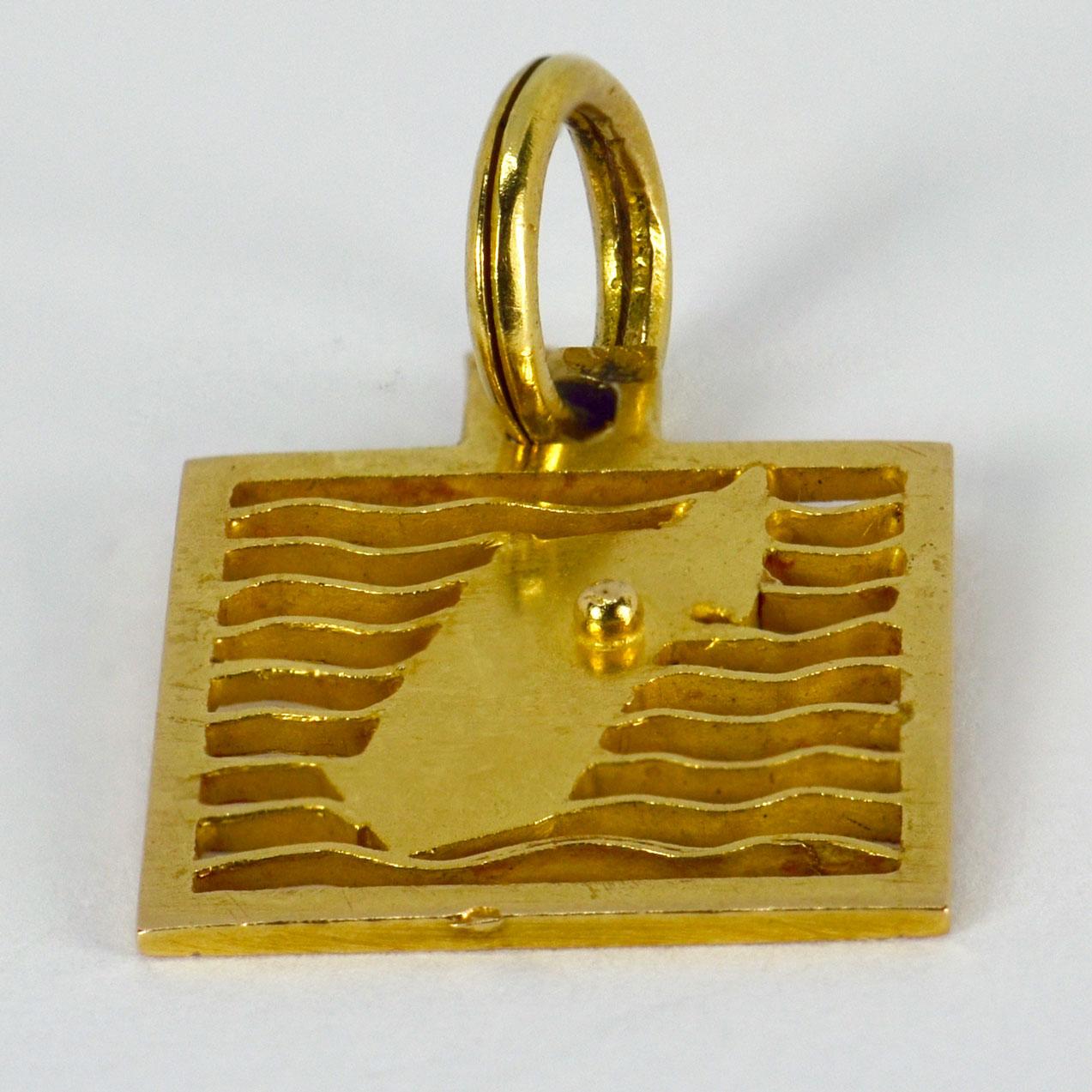 An 18 karat (18K)  yellow gold square charm pendant designed as a map of an island. Unmarked but tested as at least 18 karat gold.

Dimensions: 1.8 x 1.5 x 0.2 cm (not including jump ring)
Weight: 2.40 grams
