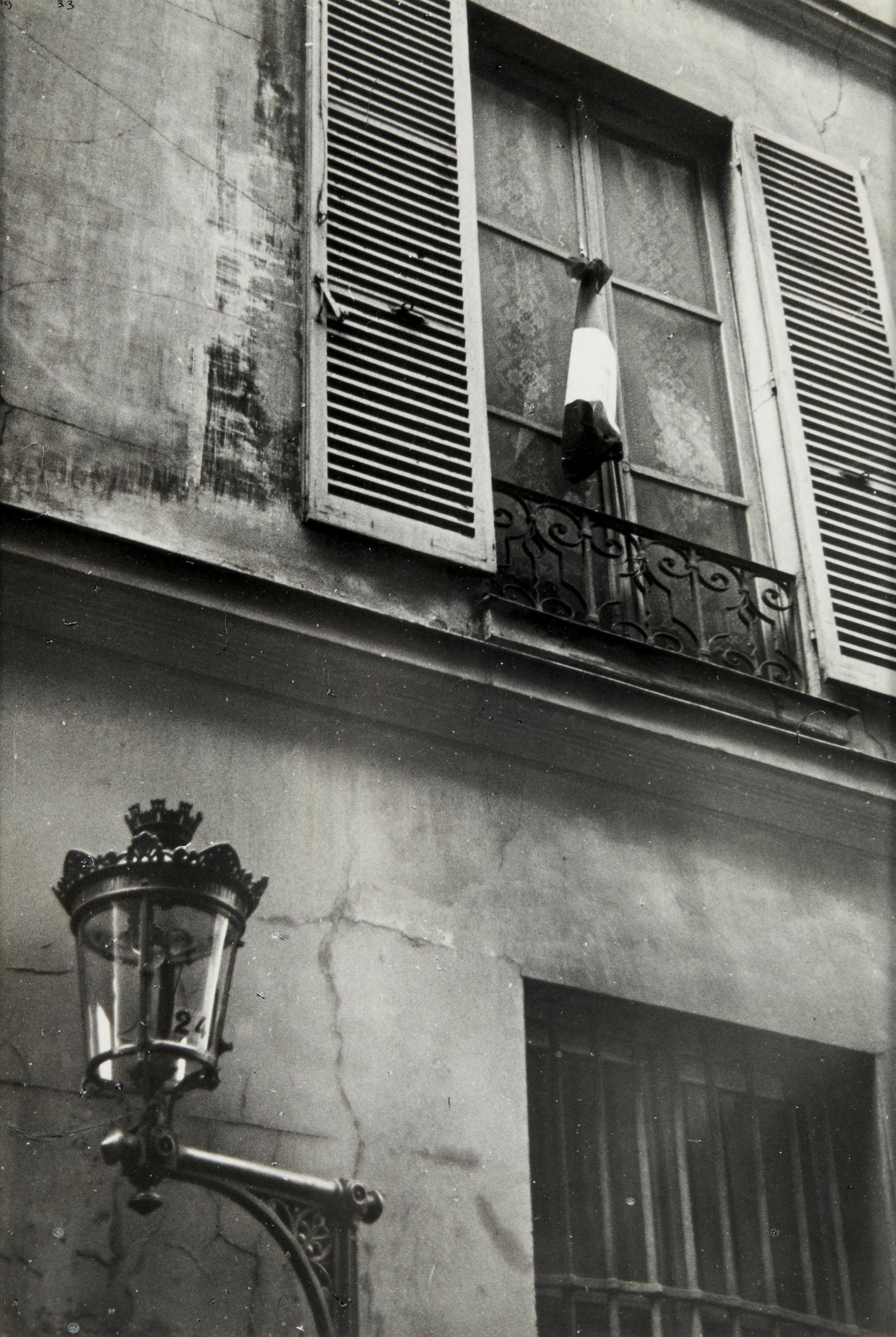 Ilse Bing
Façade with French Flag, Paris, 1934
Signed and dated
Silver gelatin print
11 x 7 1/4 inches

Ilse Bing (1899-1998), working with a Leica, brought a radical precision to the observation of daily life. The works on view - depicting dancers