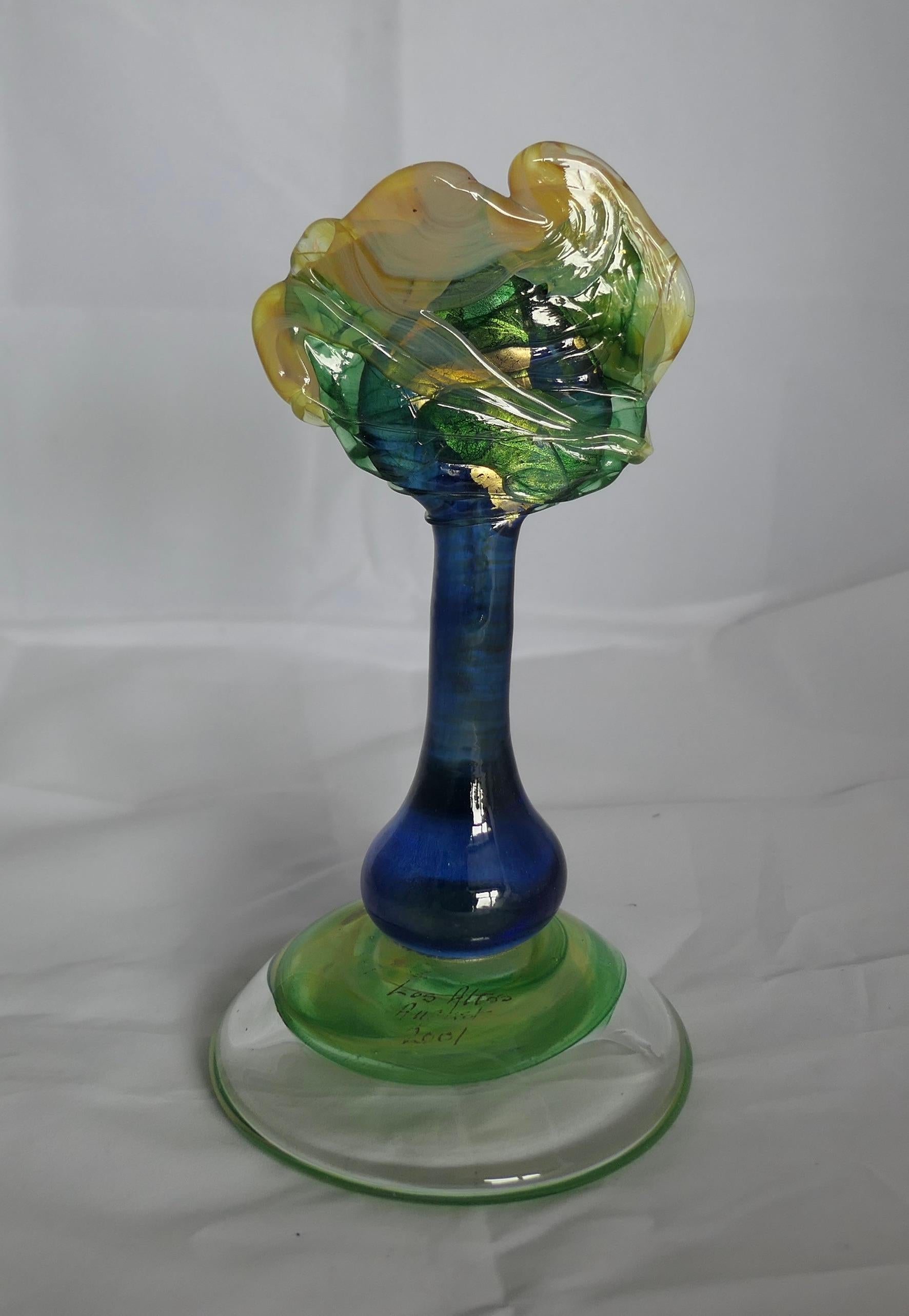 Isle of Wight Studio Glass Tree Signed Martin Evans

Superb piece in the Arts and Crafts Style Signed Martin Evans 2001, the tree is is in neon blue with Green and Gold
On the upper side of the base is the title “Los Altos August 2001”, this is
