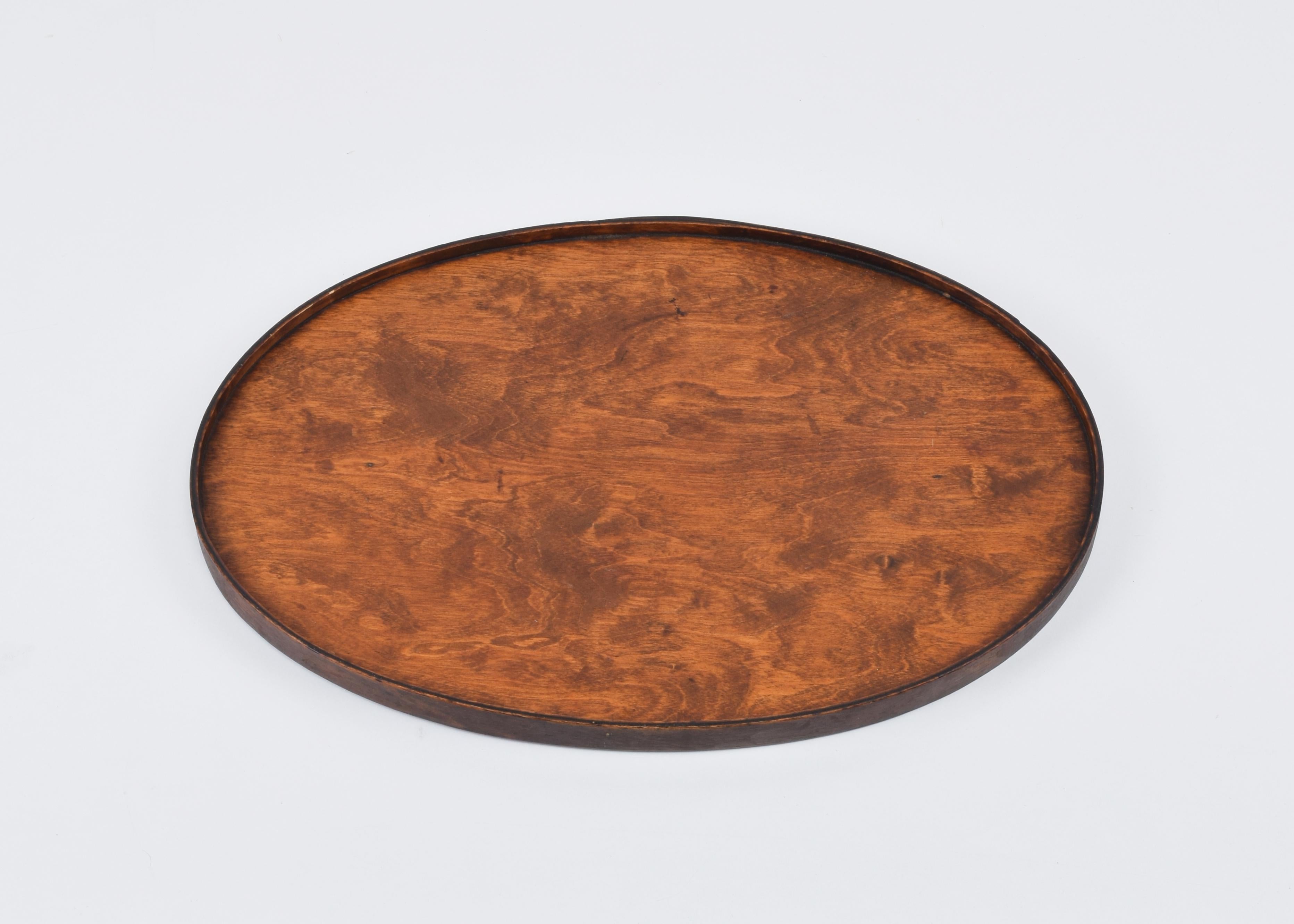 Isokon Furniture Company (design team, UK)
Isokon Tray
Designed c. 1933, produced by Luterma in Tallinn (Reval) Estonia, for Venesta, UK. Retailed by Isokon.

Stained birch plywood.
Very good original unrestored condition.

This tray is the oval
