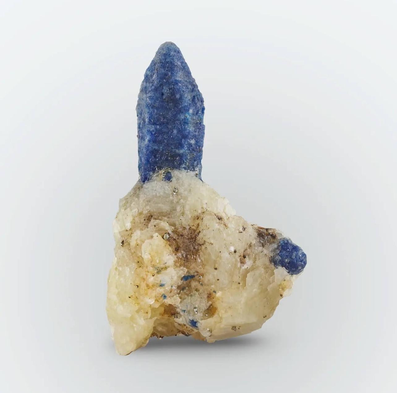Product Information:

Specimen Type: Afghanite crystals on Calcite

Weight: 42 grams

Dimension: H: 5.8 x W: 3.7 x D: 3 cm

Origin: Ladjuar Madan, Sar-e-Sang, Koksha Valley, Badakshan Province, Afghanistan

Description:

Standing boldly amidst a bed