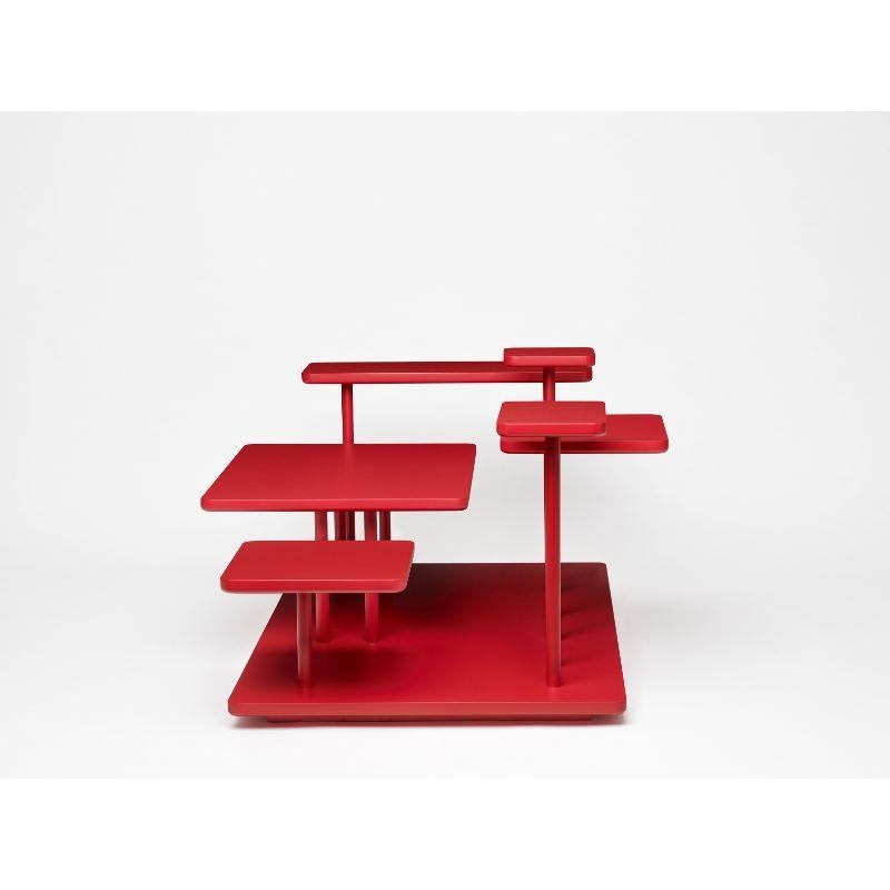 Isole, coffee table, ruby red by Atelier Ferraro
Dimensions: L 101 cm x W 55 cm x H 44,5 cm
Materials: MDF/ Wood

“Isole” is an elegant coffee table which challenges conventional shapes and creates a fluid and sculptural collage of whatever