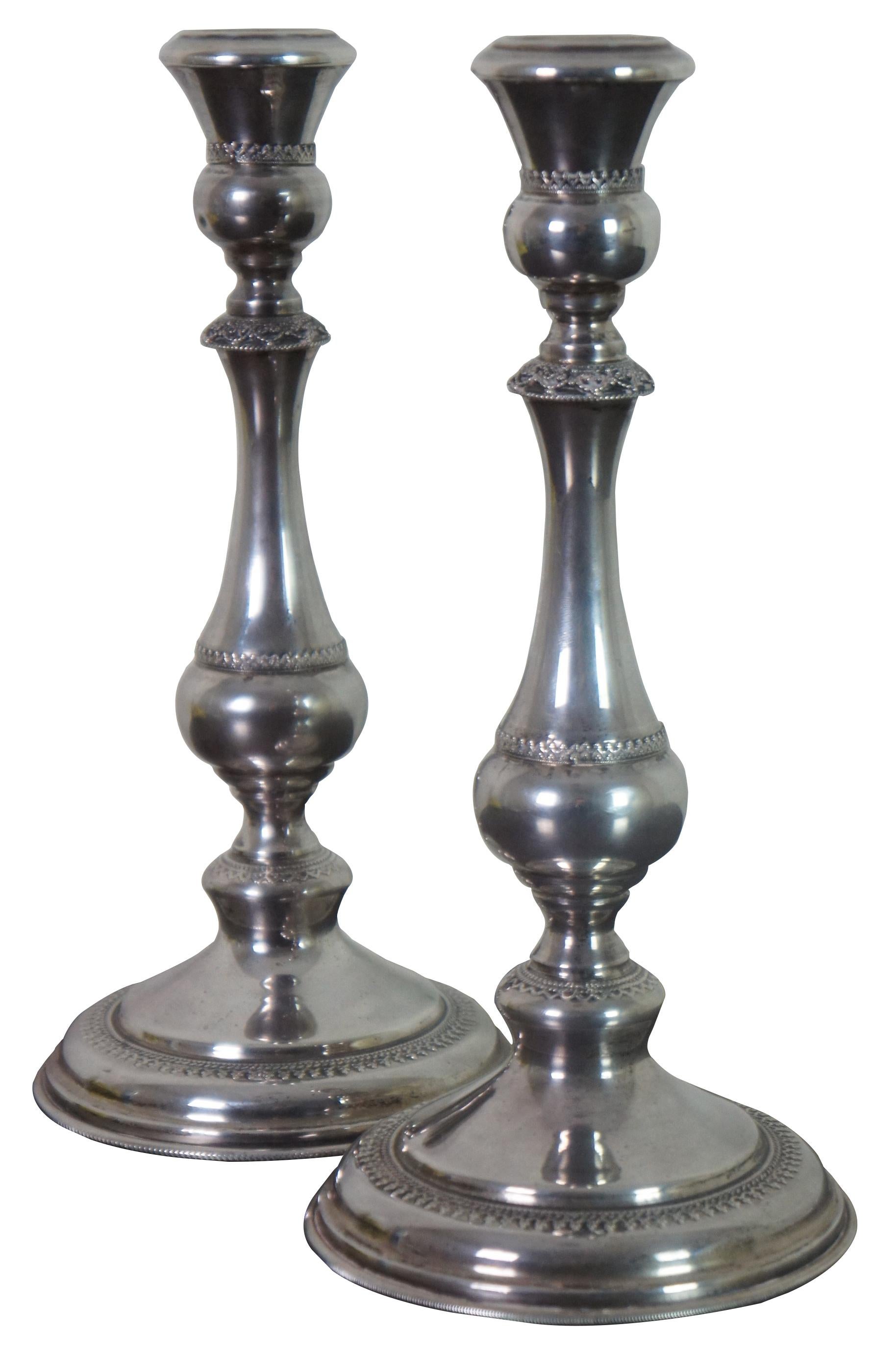 Vintage pair of Ben Zion Israel sterling silver candlesticks / Shabbat / holiday candle holders with ornated tapered form and scalloped details. Marked inside cups.

Provenance : Jerome Schottenstein Estate, Columbus Ohio. Jerome was was an