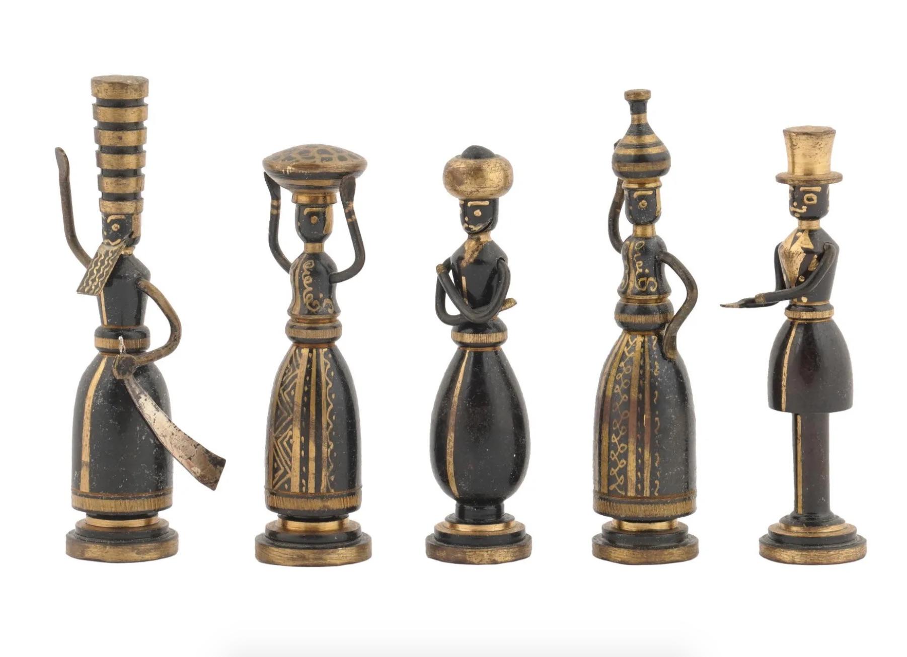 A collection of five Israeli miniature patinated brass figurines by Hans Teppich. The figurines depict Biblical women, Esther, Shulamith, Salome, Deborah. Each figurine is marked with a stamp on the bottom. Hans Teppich, Israeli, German, 1904 to