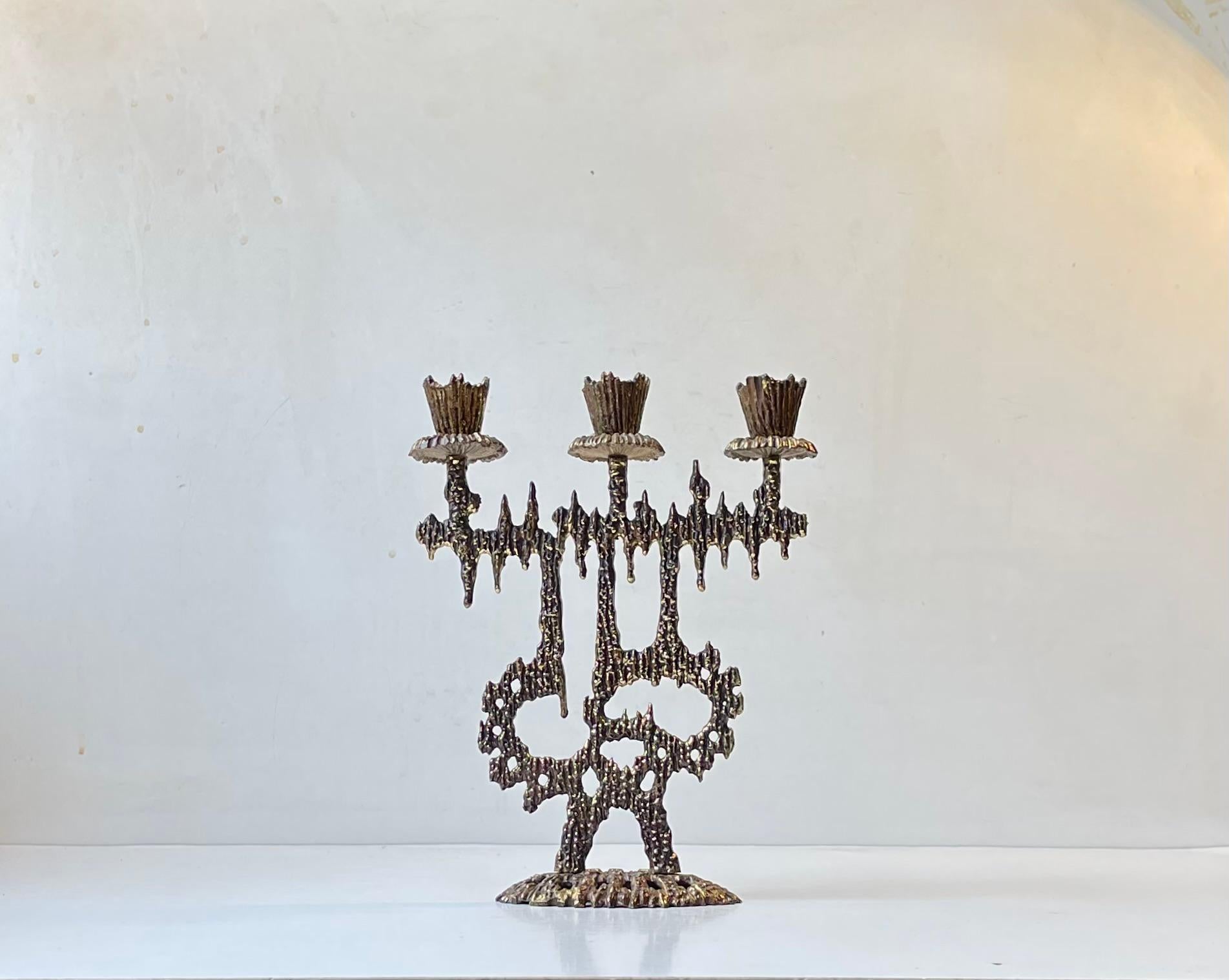 Small intricate Bronze Menorah Candlelabra manufactured by Wainberg in Israel during the 1950s or 60s. Distinct and characteristic brutalist styling. It takes 3 regular sized candles. Stamped: Wainberg and Made in Israel. Measurements: 23x18x6 cm.