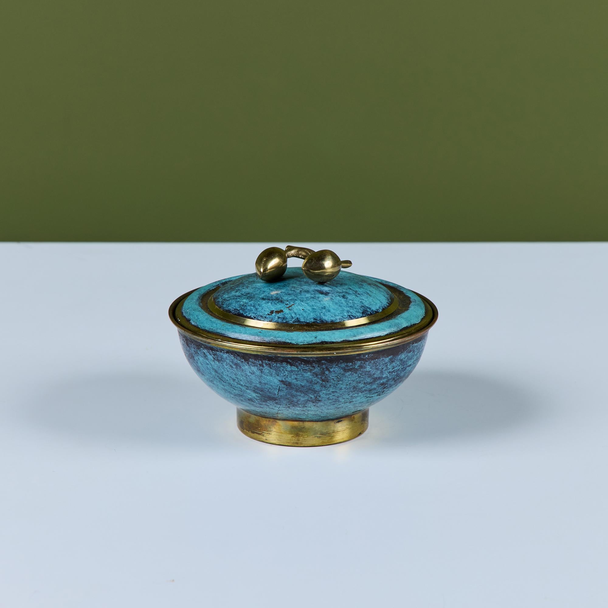 Pal-Bell round bowl with lid. This piece features a verdigris bronze bowl and lid with floral detailed knob with brass tips. Perfect for stashing keys, jewels or potpourri. An embossed stamp on the underside of the bowl reads PAL BELL - Made in