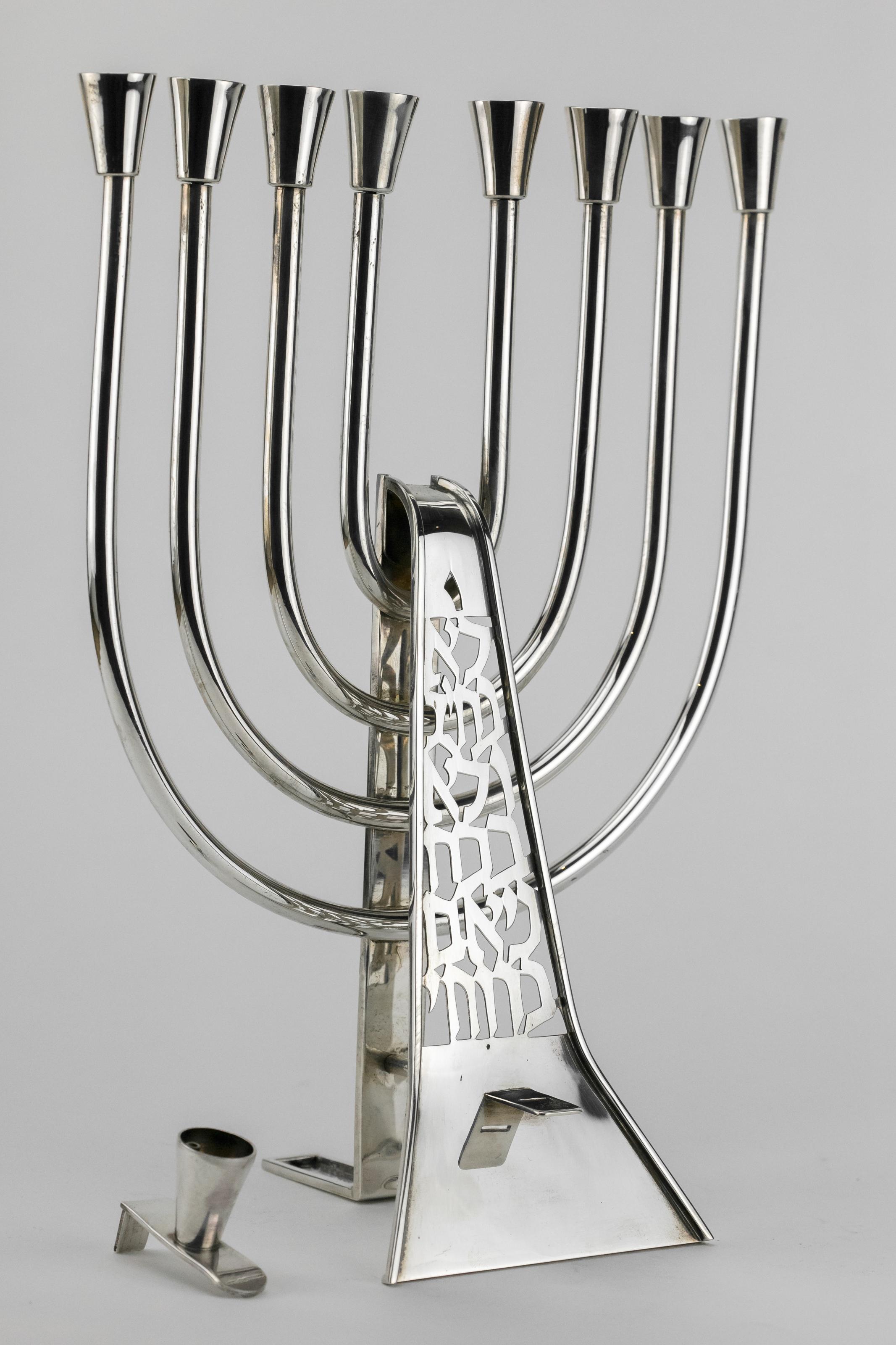 Designed in Modern Style, hand wrought and hammered, cut with Hebrew letters the verse: 