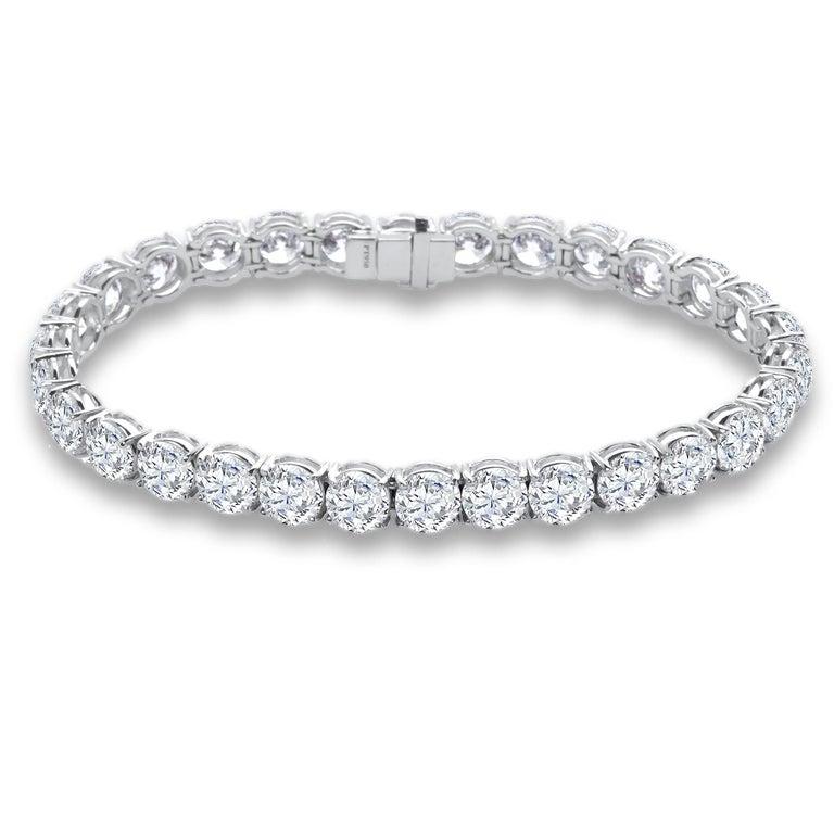 Sophisticated elegance. 
Handcrafted in 18k white gold. Set with 38 round ideal cut brilliant Diamonds for a total carat weight of 11.87.
The Diamonds are near colorless (D-G) and having clarity of SI2.
We designed this bracelet as very low profile