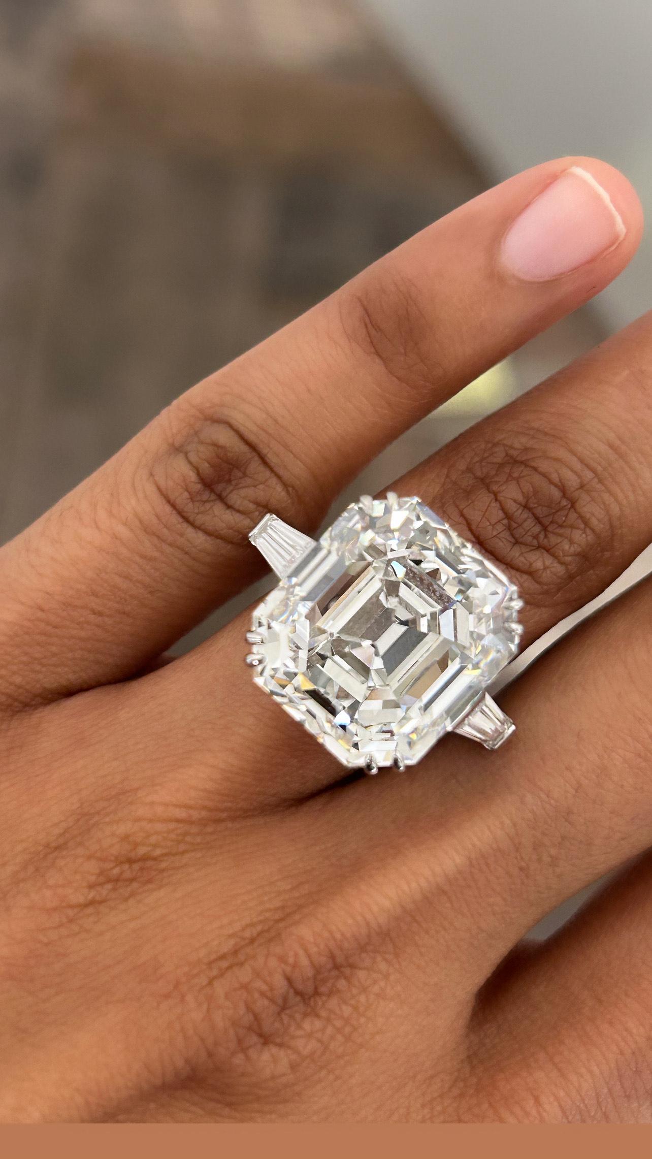 This Issac Nussbaum GIA certified 27-carat Asscher-cut diamond is a rare marvel of craftsmanship, commanding attention with its unparalleled brilliance and geometric precision. The diamond’s step-cut facets form a stunning kaleidoscope of light,