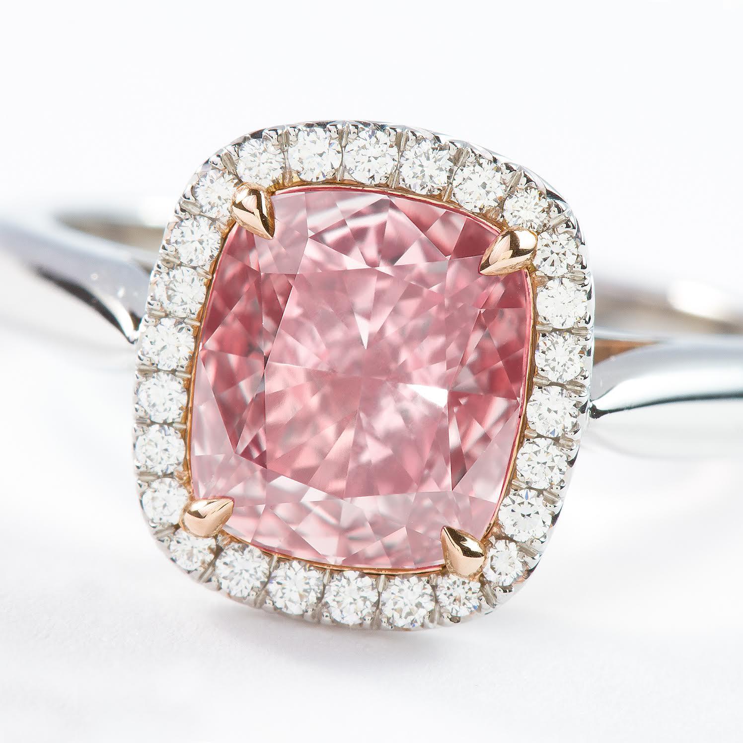 This beautiful natural color pink diamond from ISSAC NUSSBAUM NEW YORK weighs an impressive 2.02 carats and is a rare cushion shape stone with a  vs2 clarity fancy brown pink with pink being the predominant color . Set in hand made platnium and gold