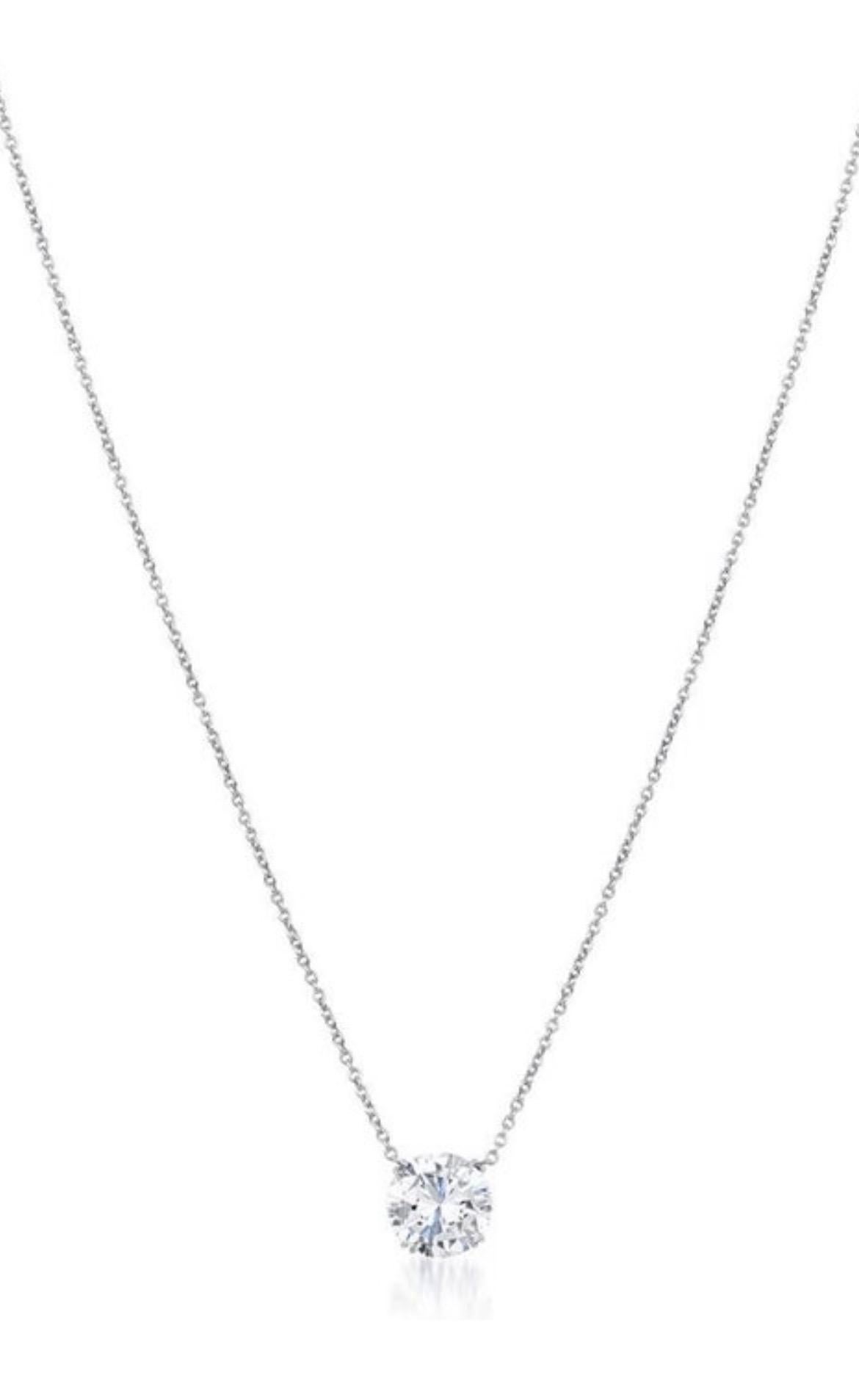 Exquisite round cut diamond pendant necklace from ISSAC NUSSBAUM NEW YORK
This dazzling diamond weighing 3.01 carat is graded by the GIA I in color si1 clarity. This diamond Is special and unique for being perfectly cut with an exceptional flow of