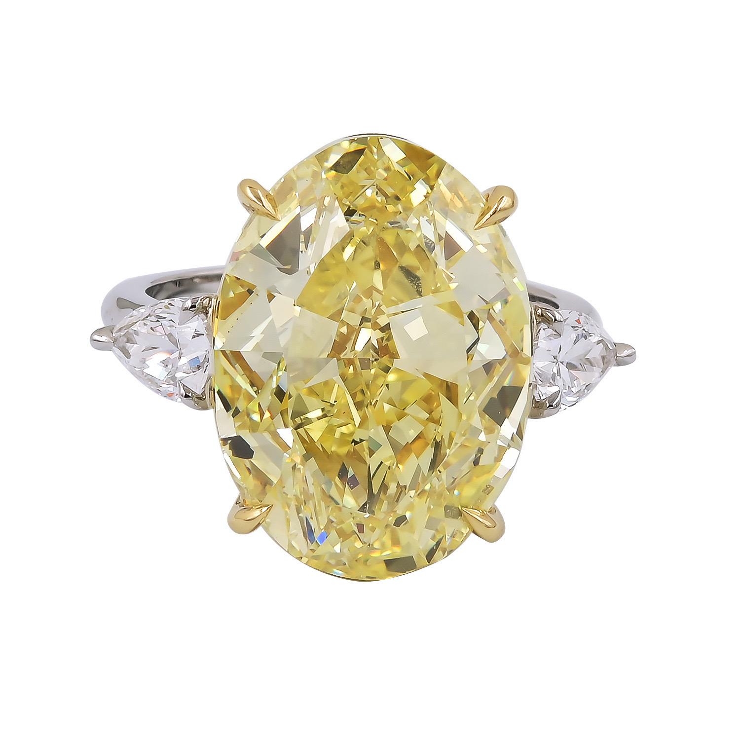 Natural Fancy Intense Yellow Diamond Ring .

A very rare and special 
Natural colored diamond ring .

This handcrafted platnium ring is set with an astonishing over TWELVE CARAT  natural INTENSE YELLOW Oval shaped Diamond .

Naturally colored