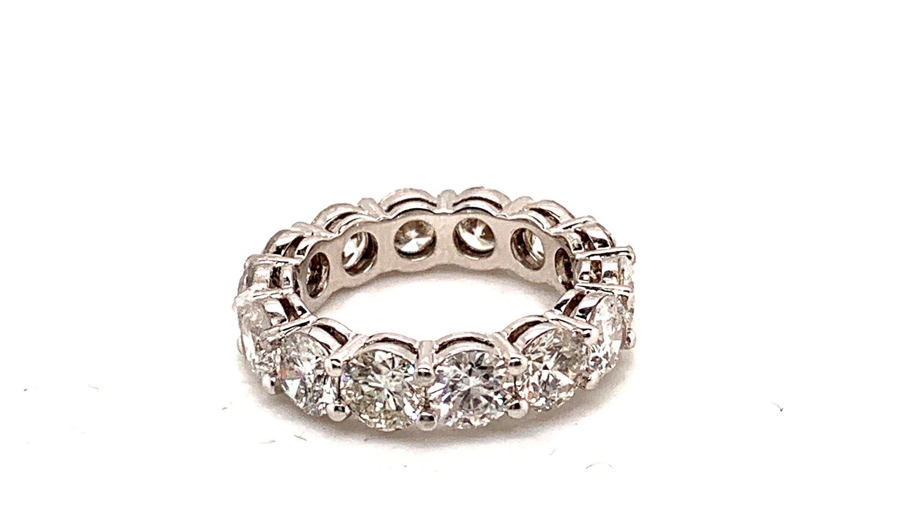 Exquisite eternity band. hand crafted in 18k GOLD each one of the 14 diamonds weigh approx. .50 carats G-H color SI clarity. The beautiful Diamonds are mounted in a share prong setting, thus showing minimal amount of metal resulting in the maximum