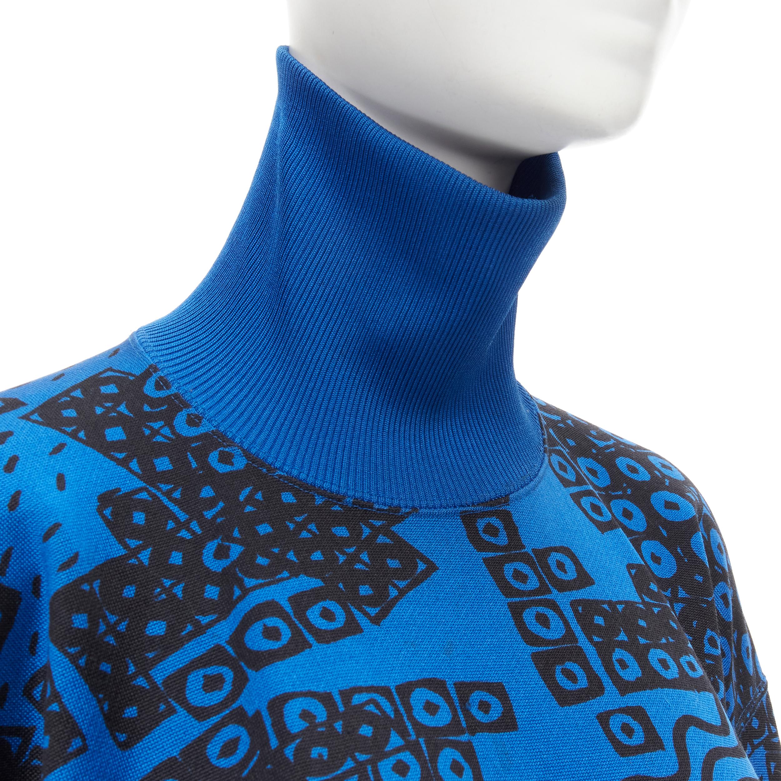 ISSEY MIYAKE 1980s blue black illustration print turtleneck sweater top M 
Reference: CRTI/A00476 
Brand: Issey Miyake 
Collection: 1980s 
Material: Cotton 
Color: Blue 
Pattern: Geometric 
Made in: Japan 

CONDITION: 
Condition: Good, this item was