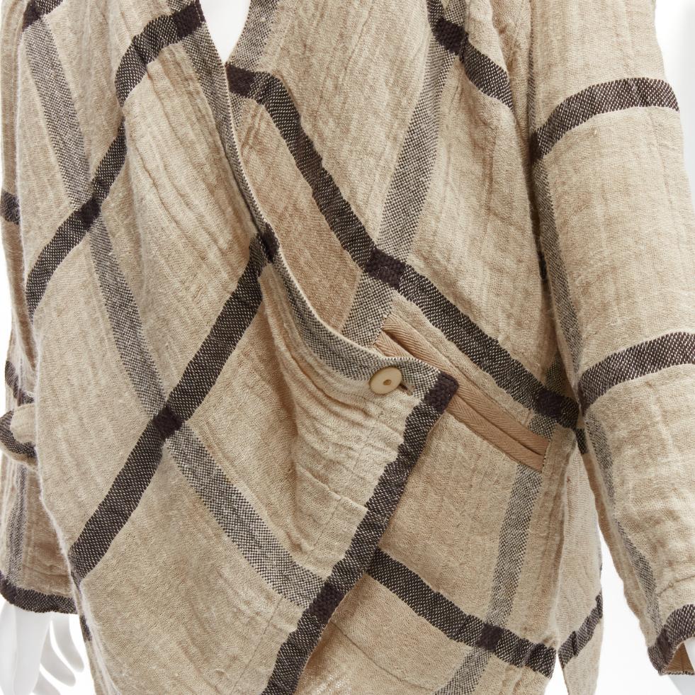 ISSEY MIYAKE 1980s Vintage beige black check wrap front oversized crinkle coat JP9
Reference: TGAS/D00310
Brand: Issey Miyake
Material: Linen, Cotton
Color: Beige, Black
Pattern: Plaid
Closure: Button
Extra Details: Loop though and wrap front detail
