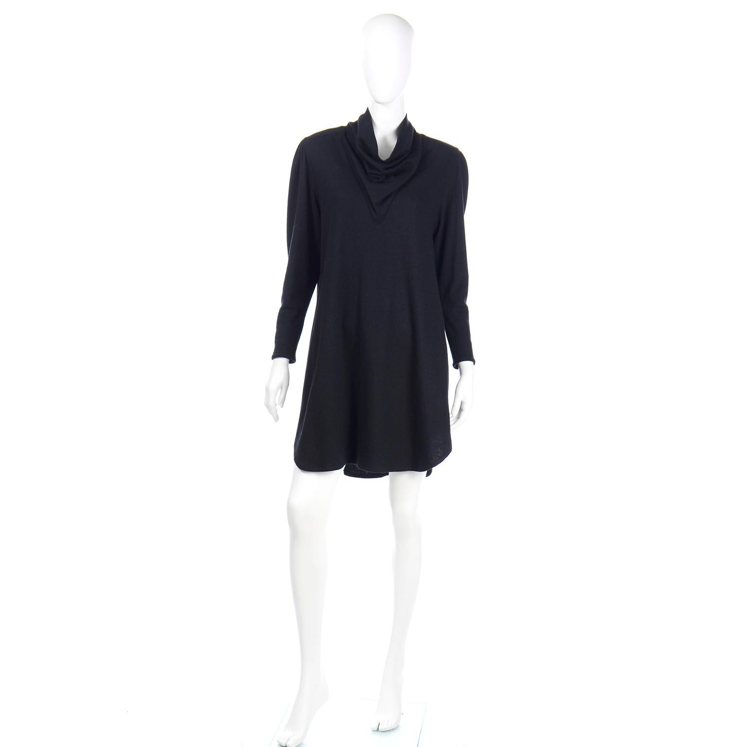 We love these fun, easy to wear vintage Issey Miyake dresses!  This vintage black dress was purchased at Henri Bendel in the 1980's and is made of 80% wool and 20% nylon.  The dress has a unique triangular shaped cowl neck that almost looks like a