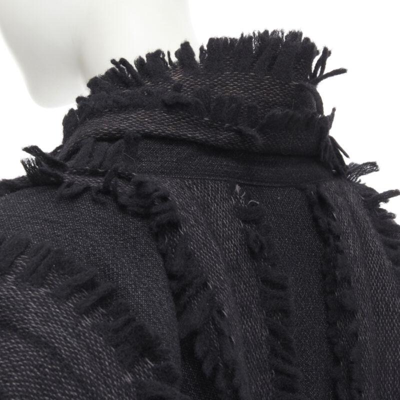 ISSEY MIYAKE 1980's Vintage grey wool fringe oversized wrap Cocoon coat M rare
Reference: CRTI/A00465
Brand: Issey Miyake
Collection: 1980s
Material: Wool
Color: Black
Pattern: Solid
Closure: Button
Extra Details: Dark grey wool. Black fringe. Wrap