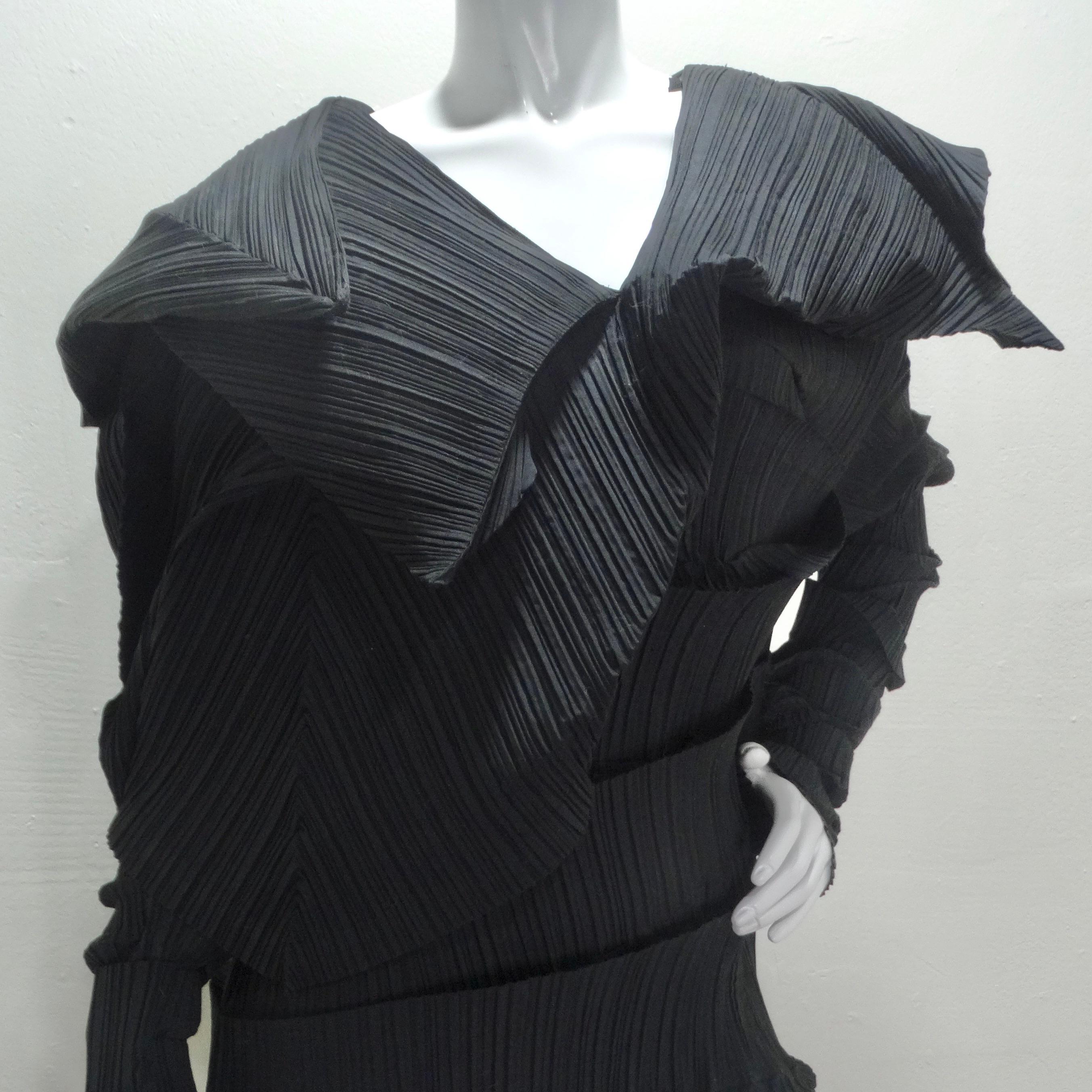 Own a piece of fashion history with this exceptional dress from Issey Miyake's 1989 Reverse Pleats Collection. Crafted in black polyester, an ideal fabric for pleating, this museum-quality dress showcases Miyake's mastery of folding techniques and