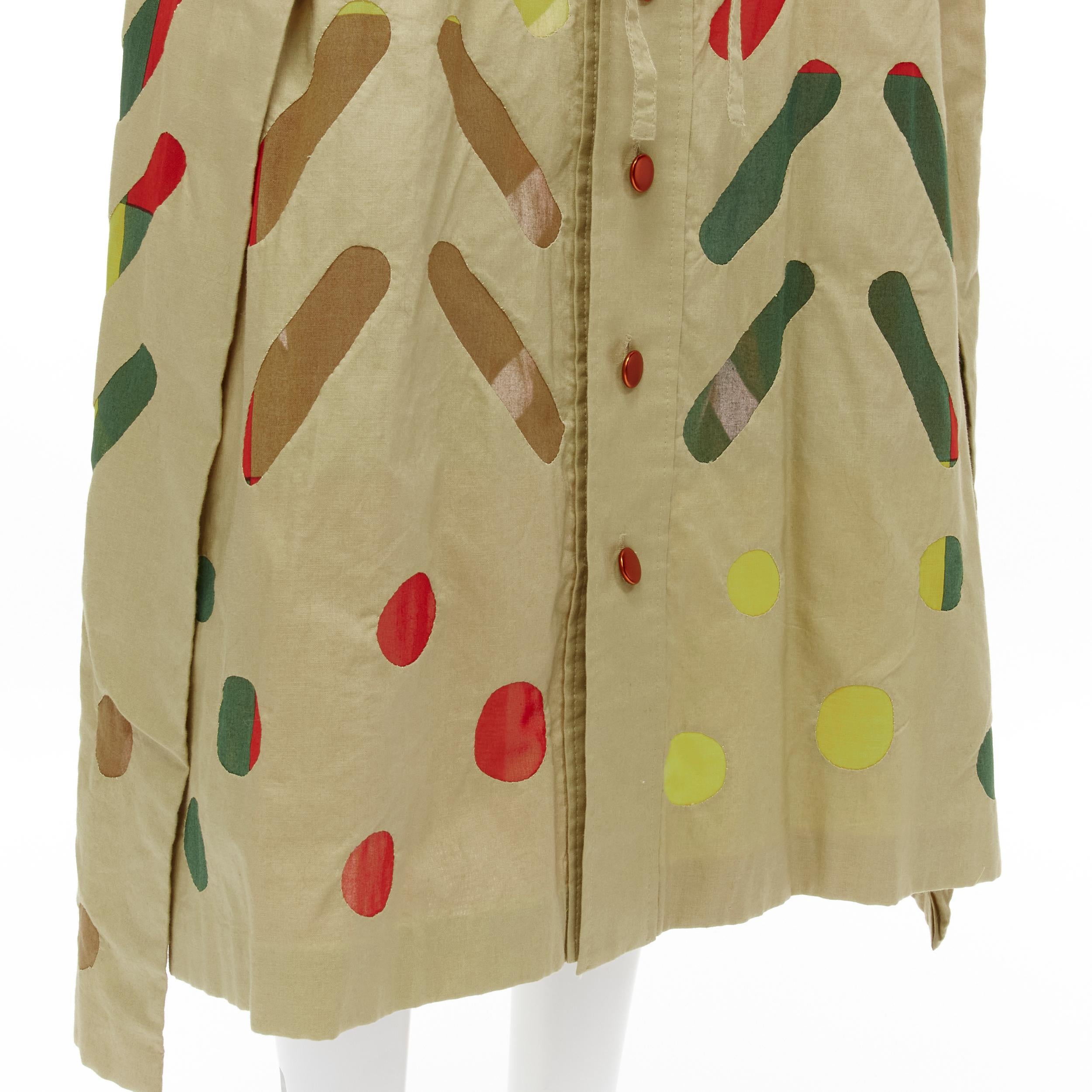 ISSEY MIYAKE 1990's cotton hand stitched colourful sheer panel button front skirt M 
Reference: CRTI/A00484 
Brand: Issey Miyake 
Material: Cotton 
Color: Beige 
Closure: Button 
Extra Detail: Beige cotton skirt. Masterfully hand crafted- each