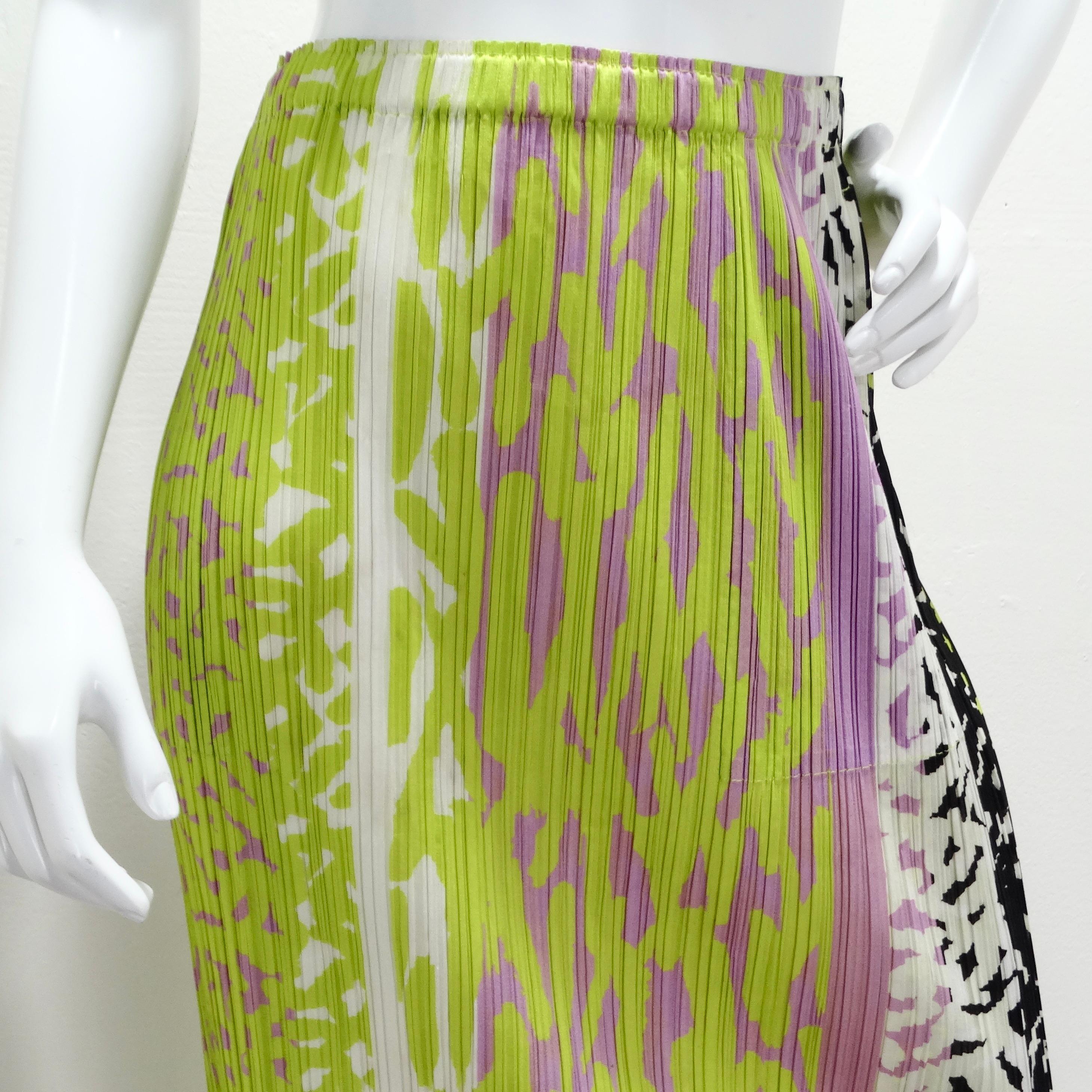 The Issey Miyake 1990s Pleats Please Multicolor Midi Skirt is a vibrant and playful piece that showcases the designer's signature pleating technique. This eye-catching midi skirt features a lively patchwork pattern in purple, green, black, and