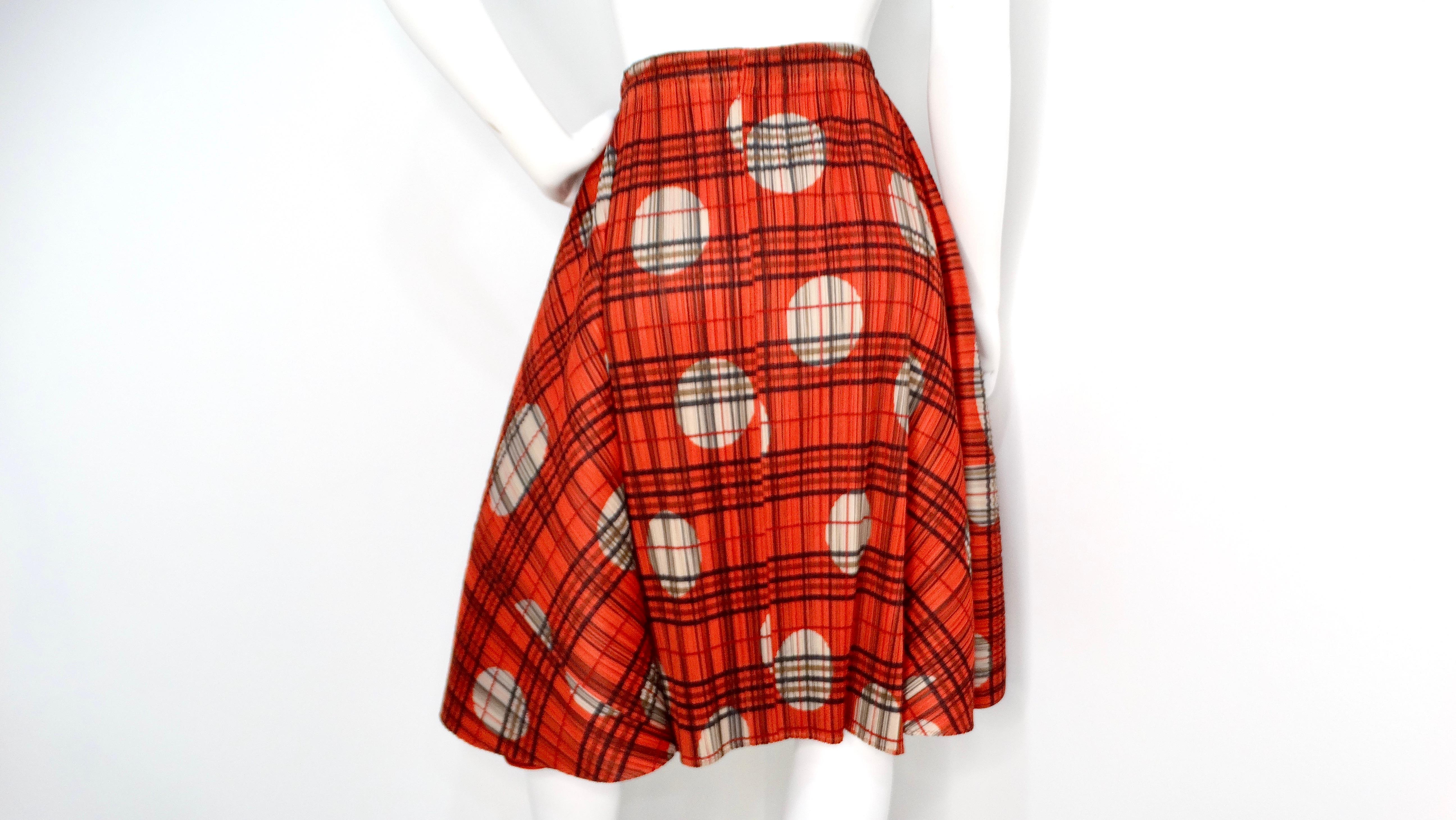 Step into the vibrant world of 1990s fashion with the Issey Miyake Pleats Please skirt, a stunning piece that encapsulates bold creativity. This unique A-line skirt features a playful mix of dark orange and red stripes adorned with black and green
