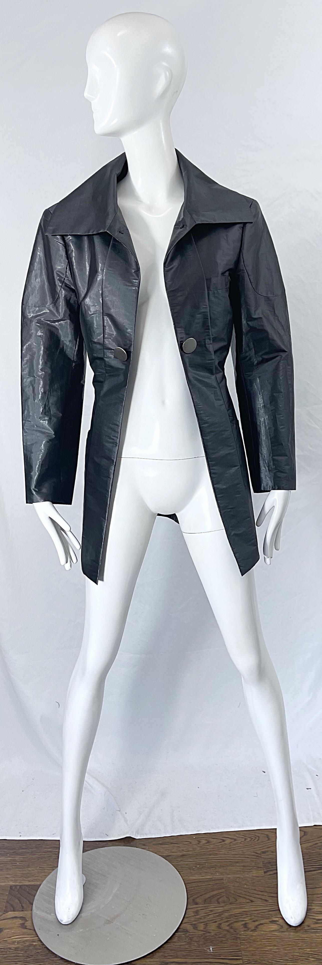 Avant Garde rare vintage 90s ISSEY MIYAKE sharkskin grey metallic trench jacket ! Features the perfect alternative to black that is perfect for anytime of year. Lightweight fabric is great for layering. Matte silver button details.  
In great