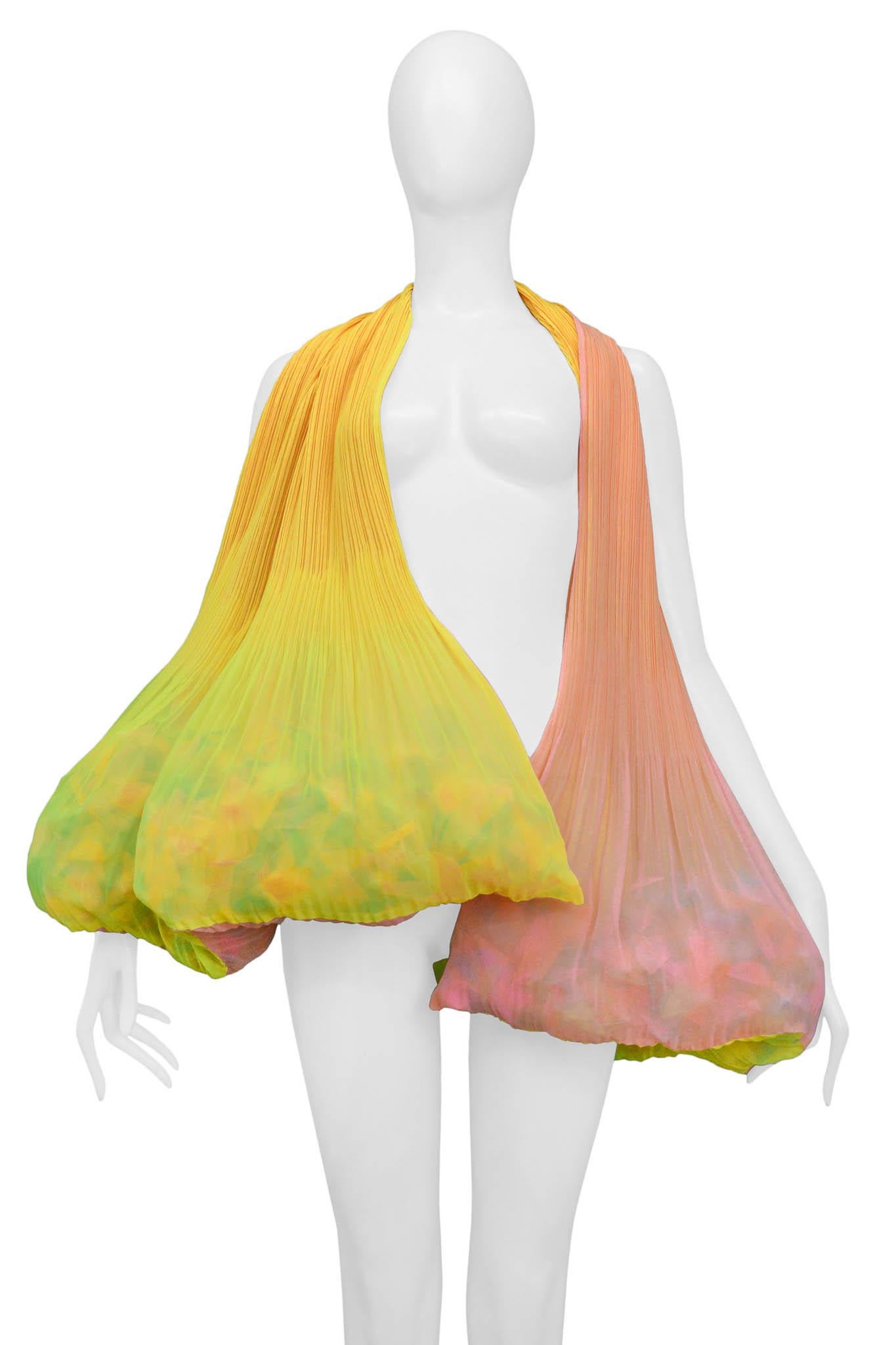Resurrection Vintage is excited to offer a vintage Issey Miyake yellow and pink confetti scarf, featuring pleating along the scarf, and rainbow confetti encased in the scarf.

Issey Miyake
Size: One Size 
100% Polyester
Excellent Vintage