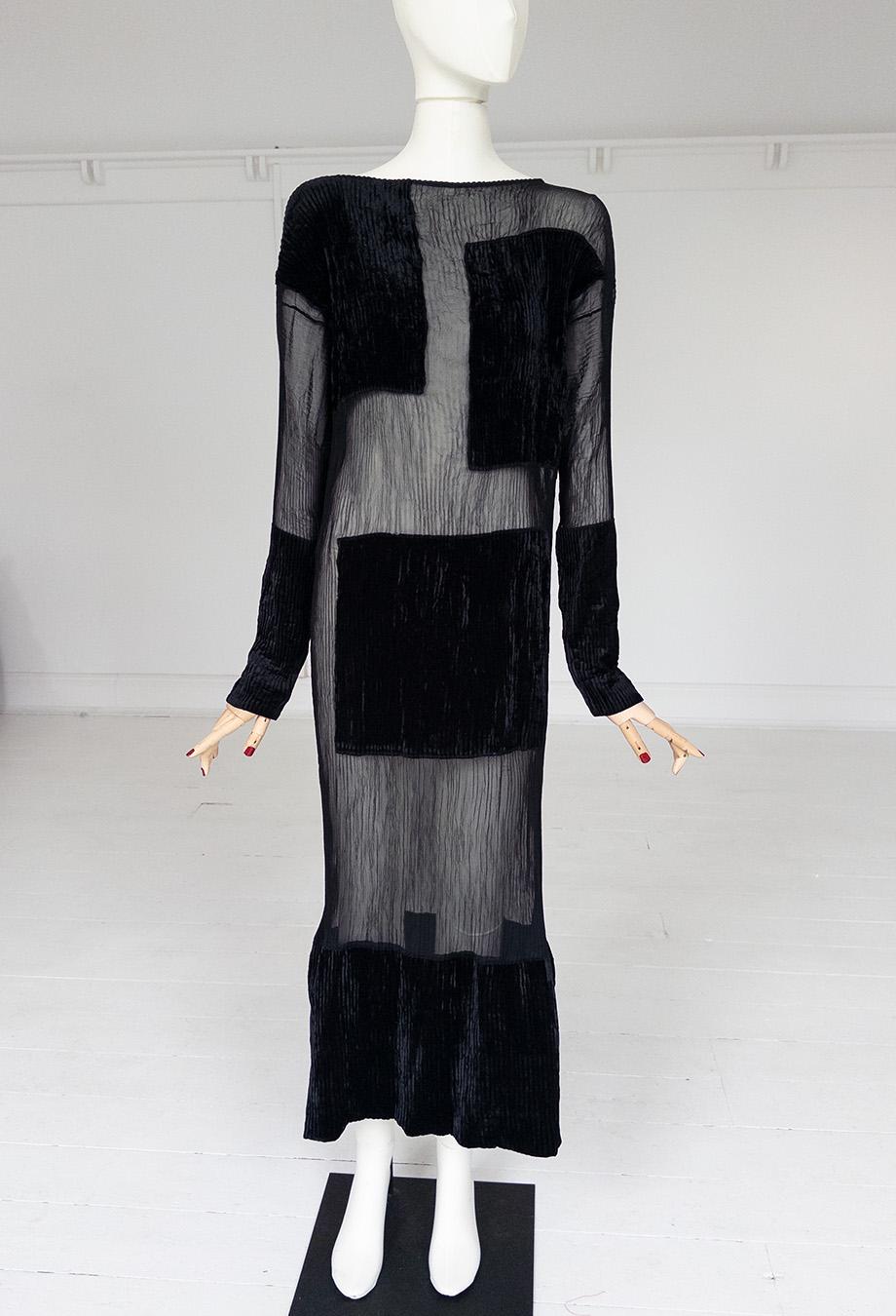 A testament to Issey Miyake's avant-garde ingenuity, this archival Fall/Winter 1994 dress captures the designer's pioneering approach to texture and form. Rendered in sheer, crinkled fabric with strategically placed velvet panels, the piece plays