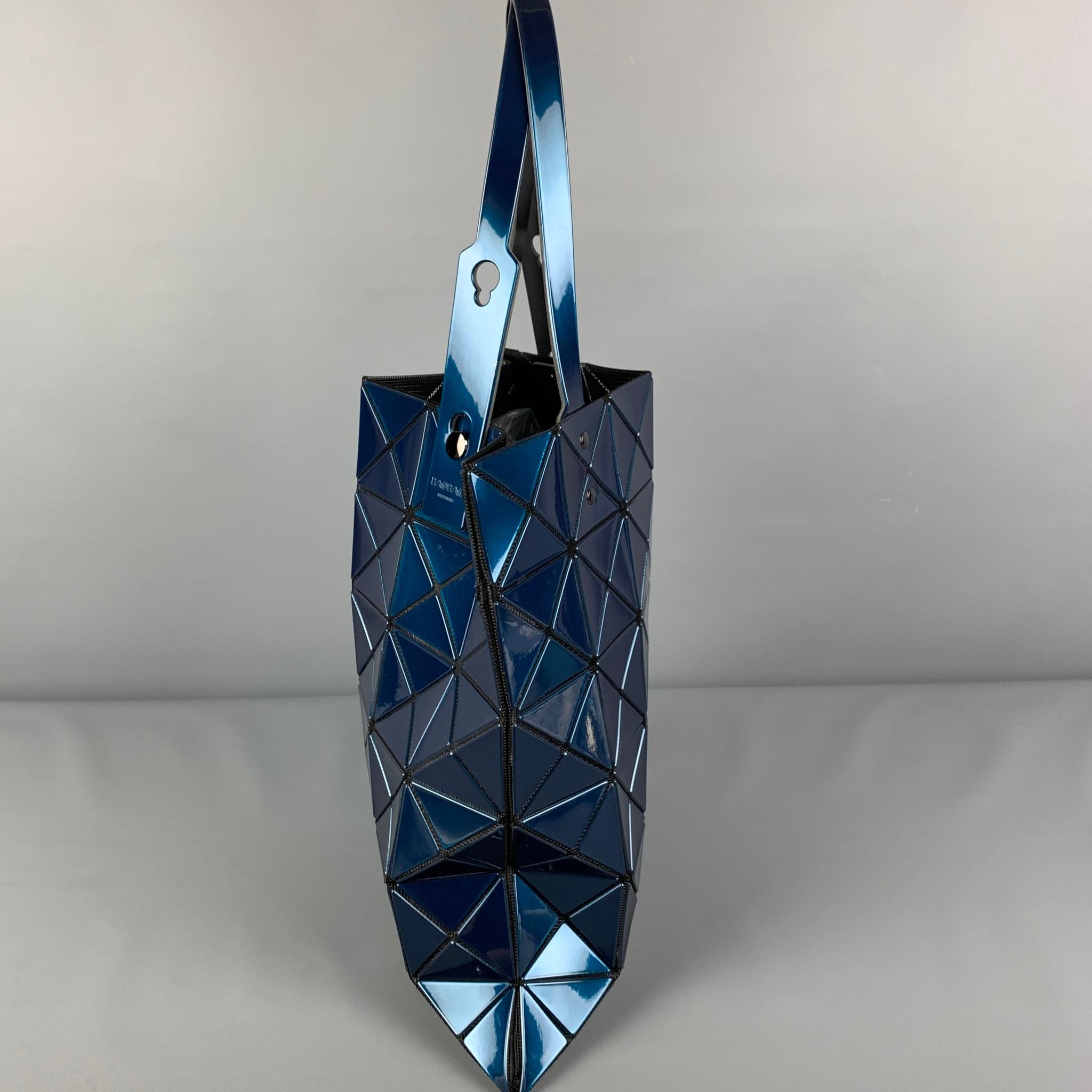 ISSEY MIYAKE BAO BAO bag comes in a blue acetate featuring signature triangular appliqués , mesh tote in black, adjustable top handles, and a inner zipper pocket. Made in Japan. 

Very Good Pre-Owned Condition.

Measurements:

Length: 13.5
