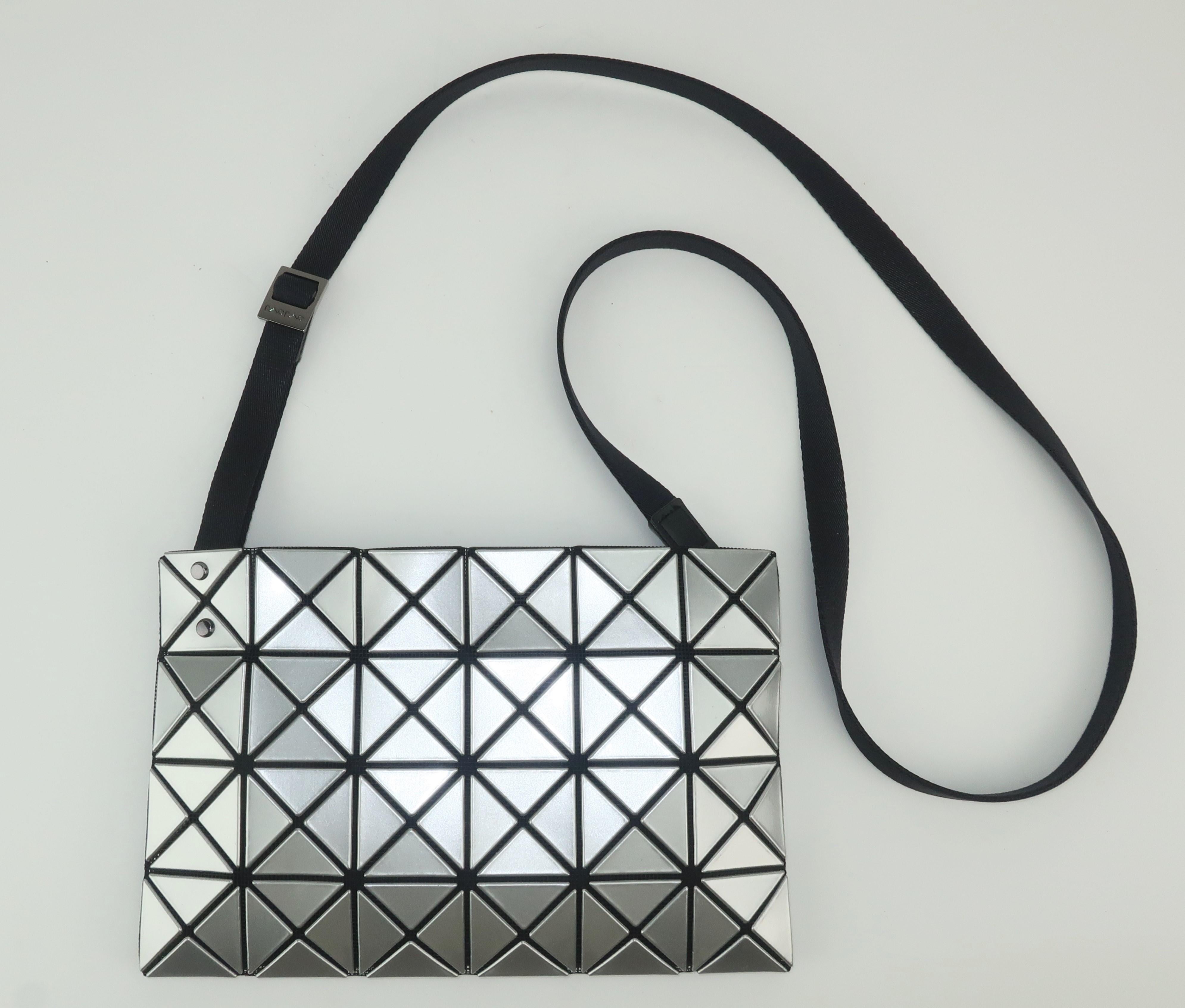 Innovative Japanese designer, Issey Miyake, created the Bao Bao line in 2000 producing handbags with a unique geometric surface.  The space age look is designed to provide a comfortable accessory that produces 'shapes made by chance' depending on