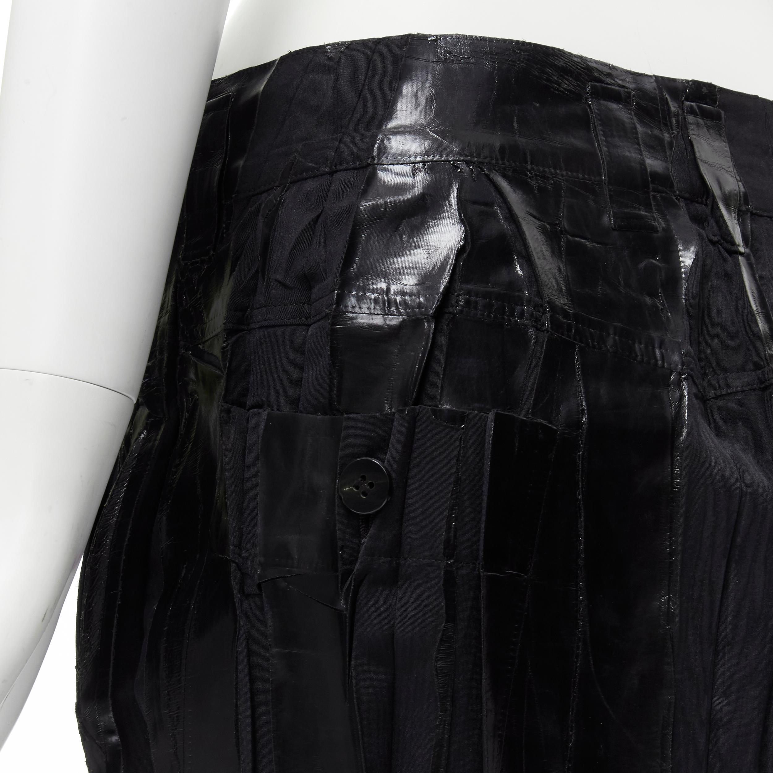 ISSEY MIYAKE black lacquer coating pleated mini skirt M 
Reference: CRTI/A00562 
Brand: Issey Miyake 
Material: Cotton 
Color: Black 
Pattern: Solid 
Closure: Zip 
Extra Detail: Button zip fly. Daal button back pockets. 
Made in: Japan 

CONDITION: