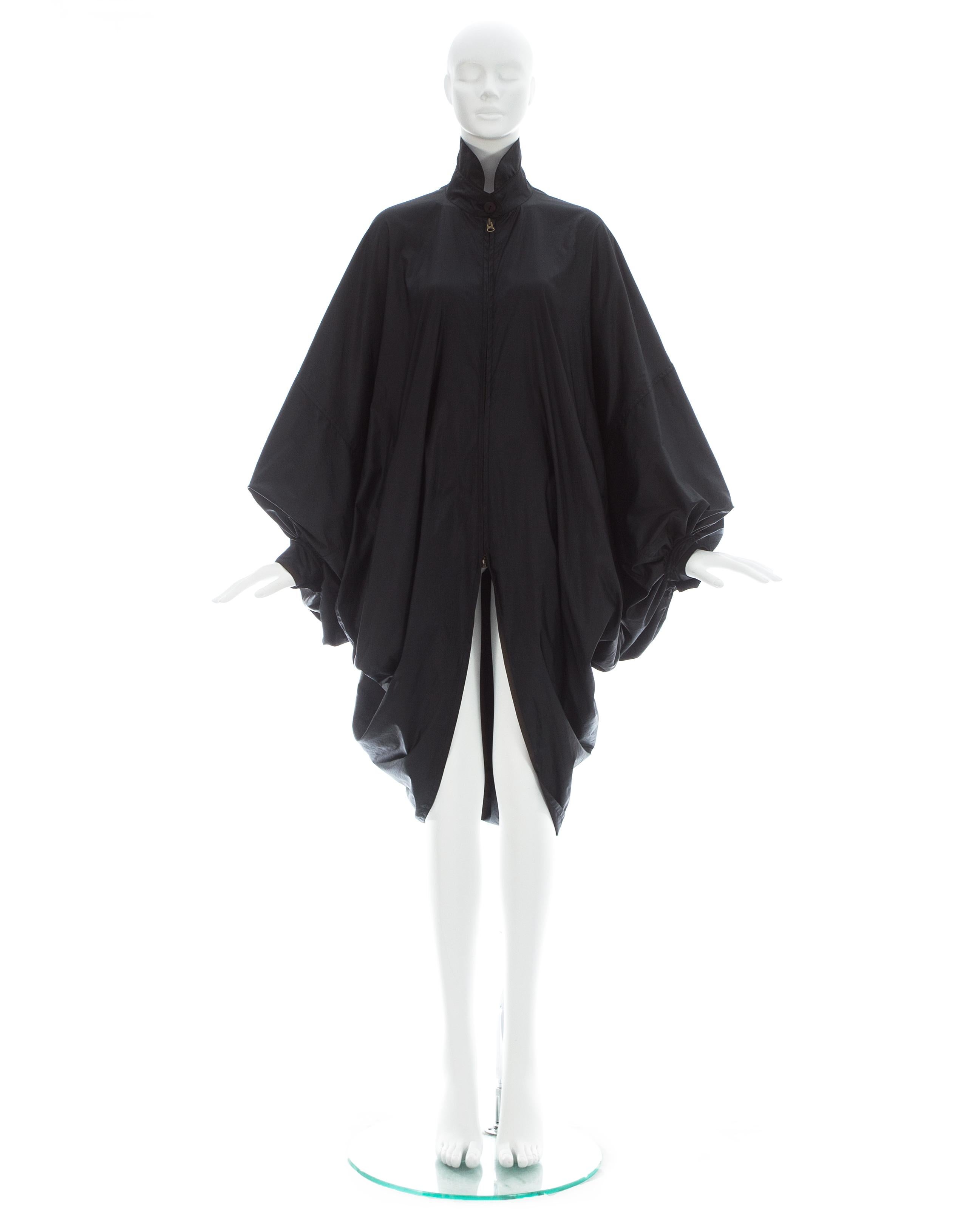 Issey Miyake; Black nylon oversized parachute coat with batwing sleeves and two front pockets

Fall-Winter 1987