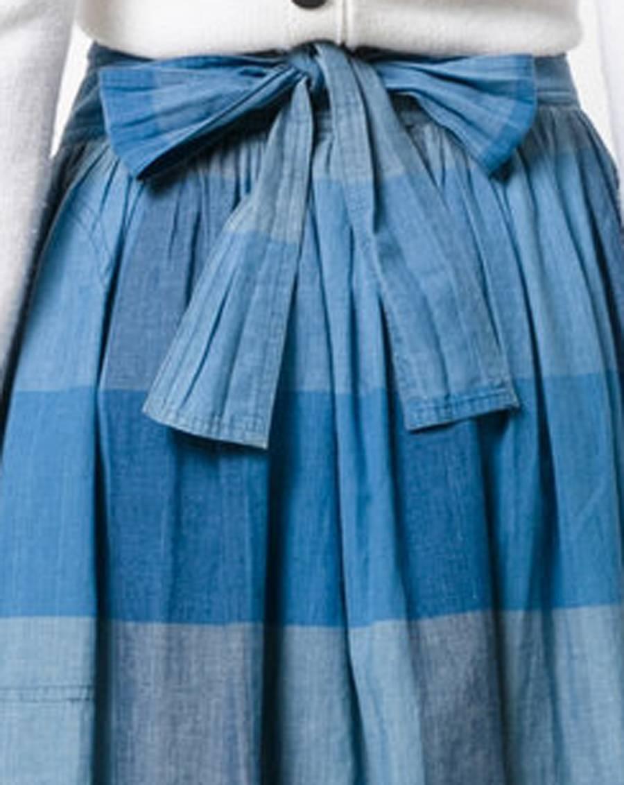 Issey Miyake blue cotton skirt featuring a checked pattern,hight waist, sides pockets, a long back tie.
In excellent condition. Made in Japan. 
 Estimated size 38fr/US6 /UK10
We guarantee you will receive this gorgeous item as described and showed