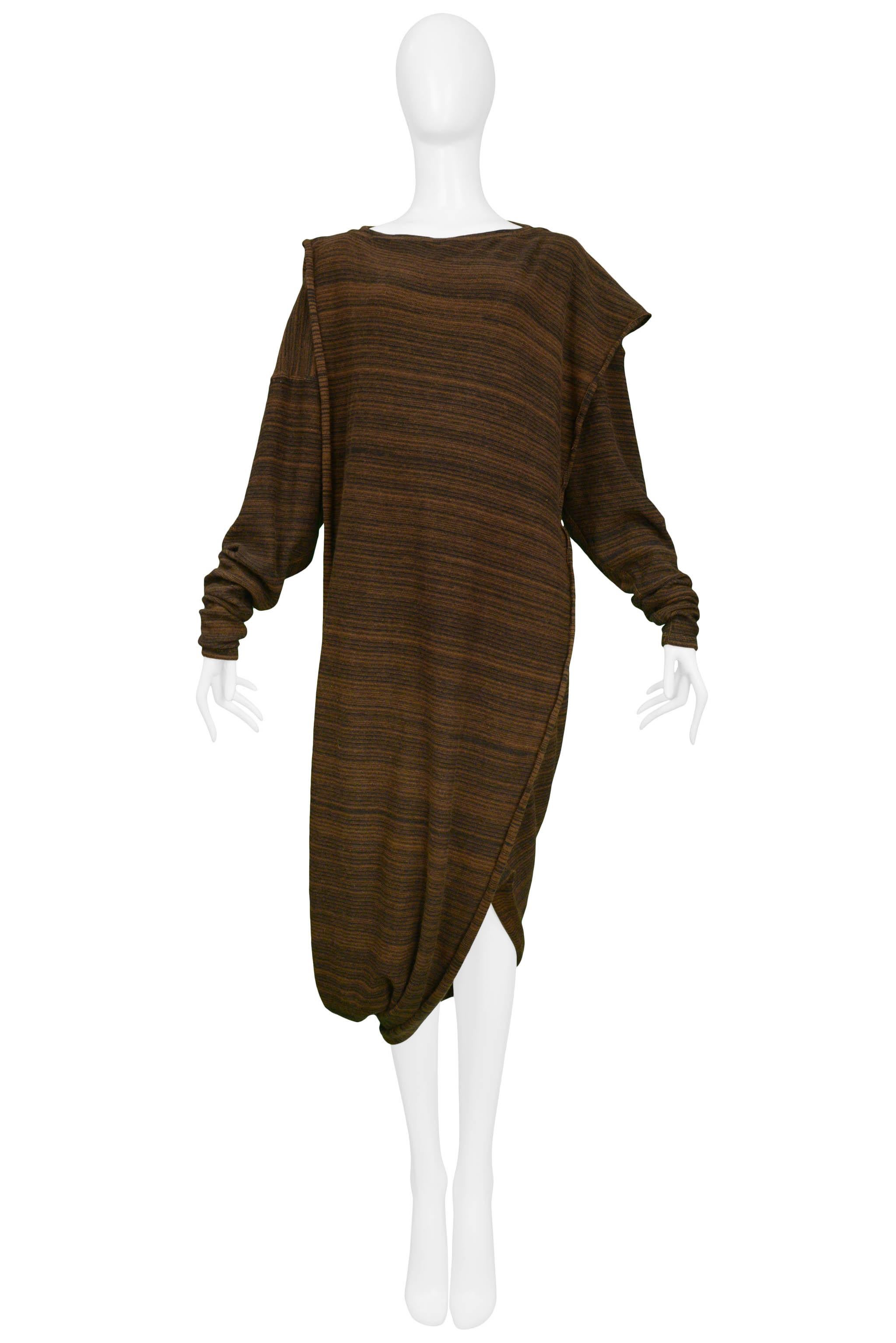 Resurrection Vintage is excited to offer a vintage 1970's Issey Miyake dark and medium brown knit toga dress with an attached over-piece, long sleeves, and 3/4 length body. 

Issey Miyake
Size S/M
Measurements: Shoulder 17
