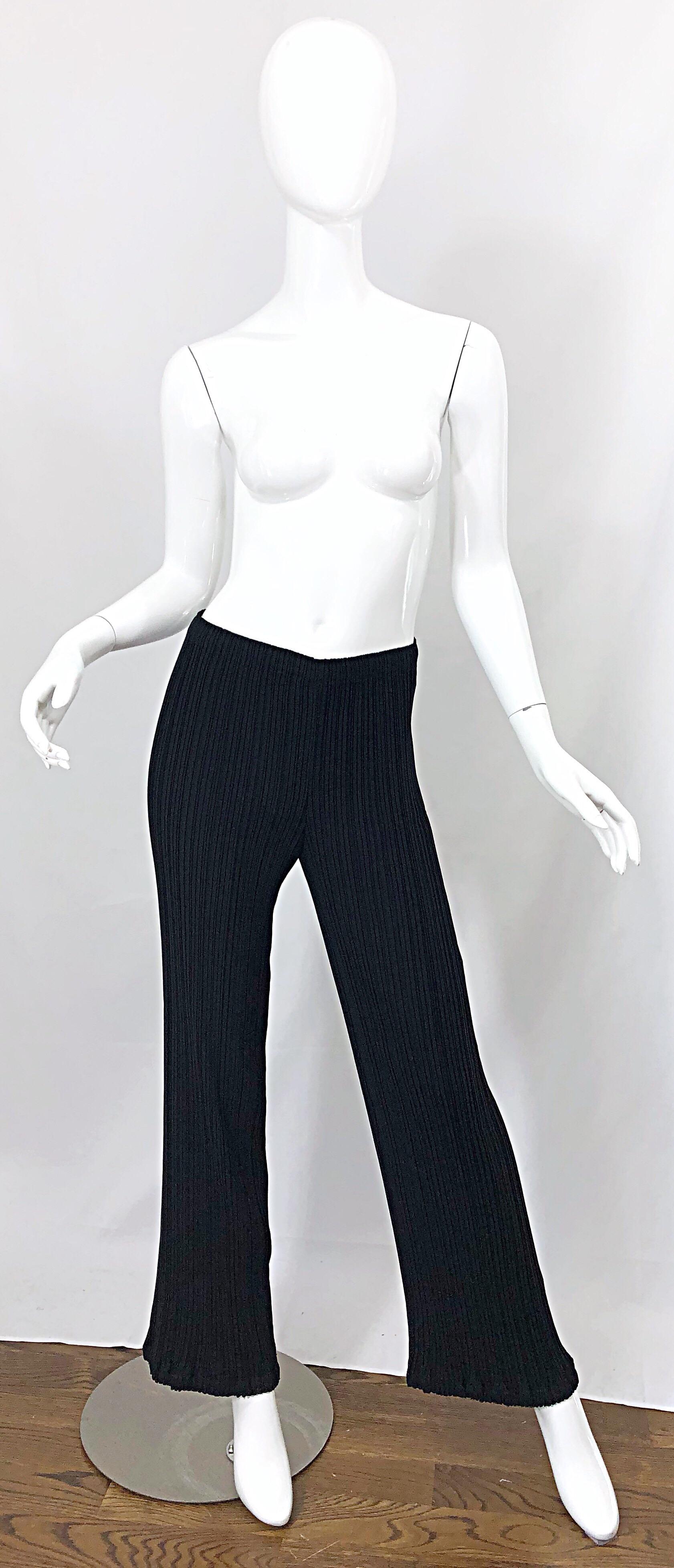 Classic, yet stylish 1990s ISSEY MIYAKE black pleated wide leg pants! Features the signature pleats that offer so much comfort while eluding style. Super flattering fit. Elastic waistband make these perfect for an array of sizes. The perfect staple!