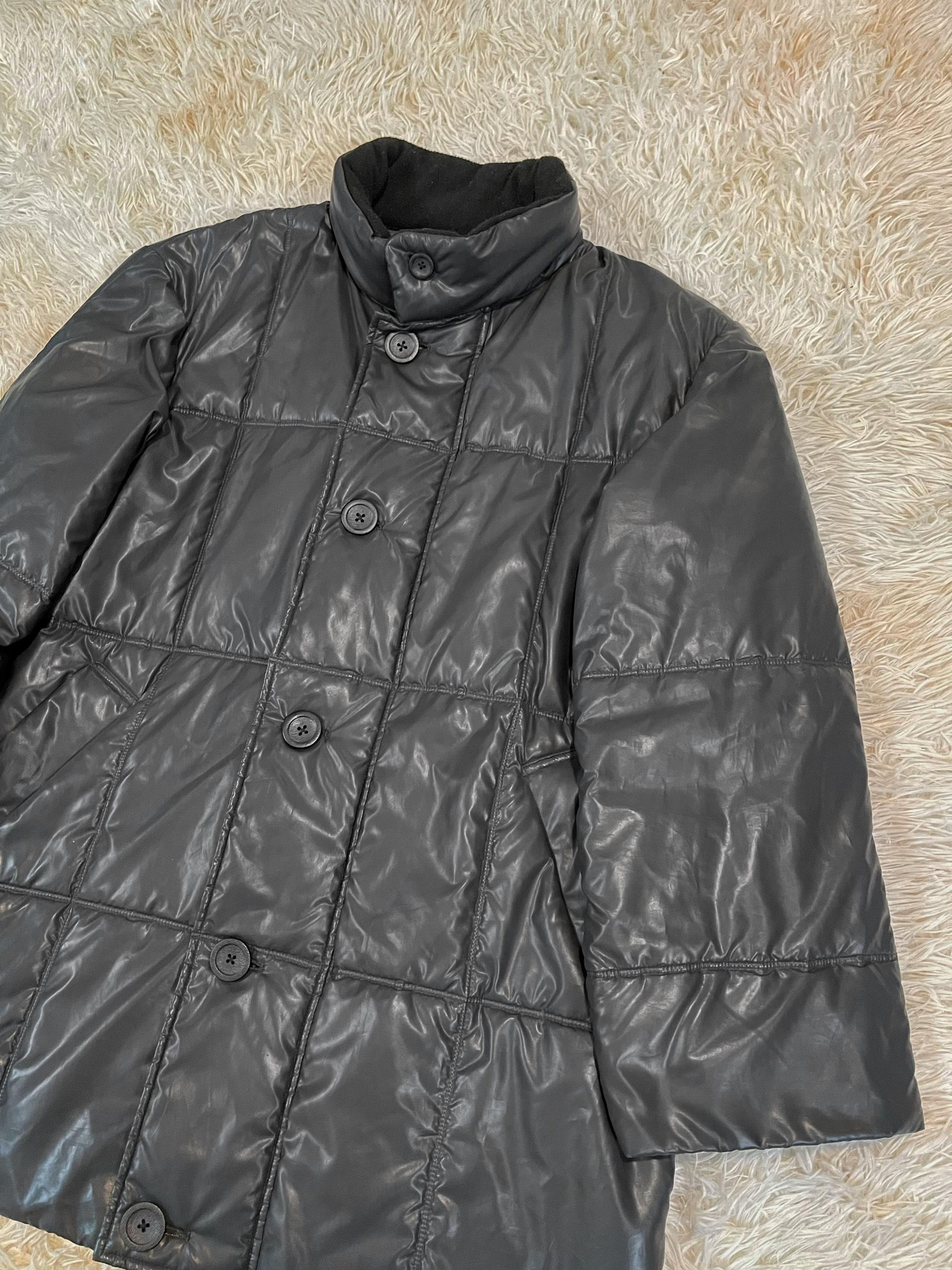 Issey Miyake A/W2001 Puffer Jacket, menswear piece

Silhouette: Relaxed, oversized fits

Fabric: Polyester and synthetic fabric throughout, with wool collar interior

Lining: Pillow lining

Season: Fall/Winter 2001

Pocket: Front x 2

Weight: