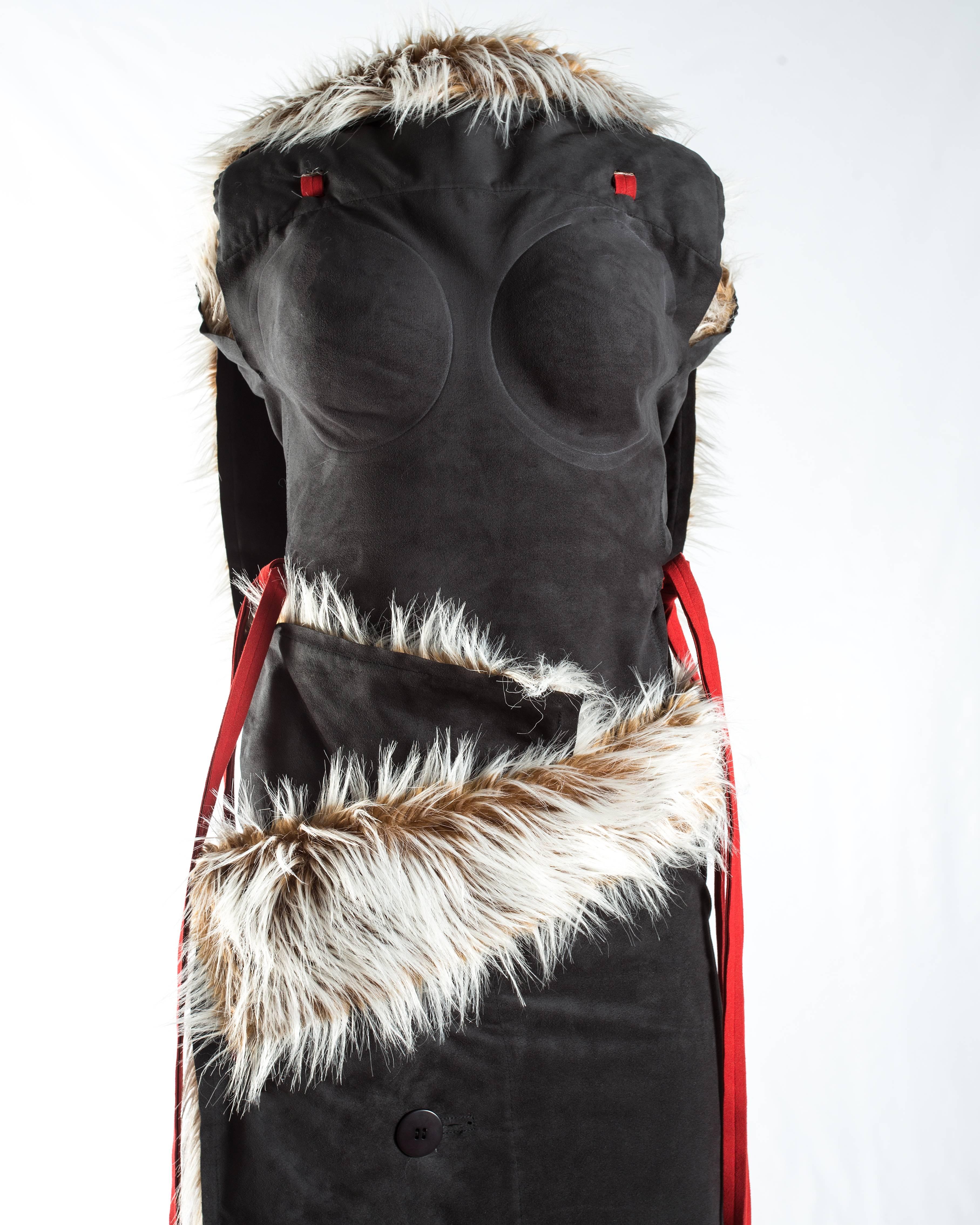 - Vest with emphasised breast panels and wrap design
- Blanket wrap skirt with button closures
- Faux fur / leatherette suede 

Autumn-Winter 2000