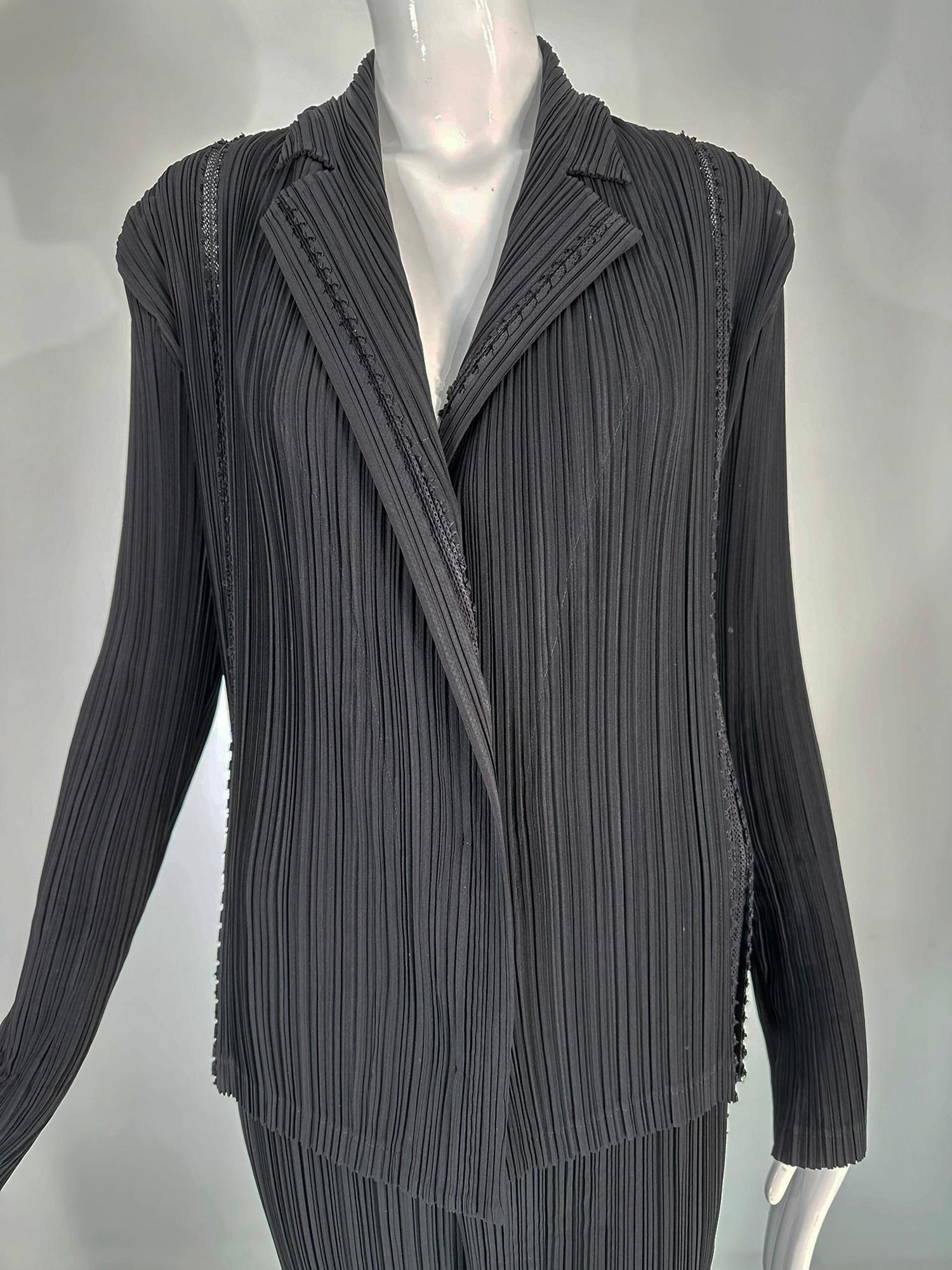 Issey Miyake Fete 2pc jacket & pant set, black pleats with open mesh insertion. Long sleeves hidden button closure jacket with notched lapel collar, open work mesh at seams throughout. Matching pant with elastic waist, full leg and open work mesh at