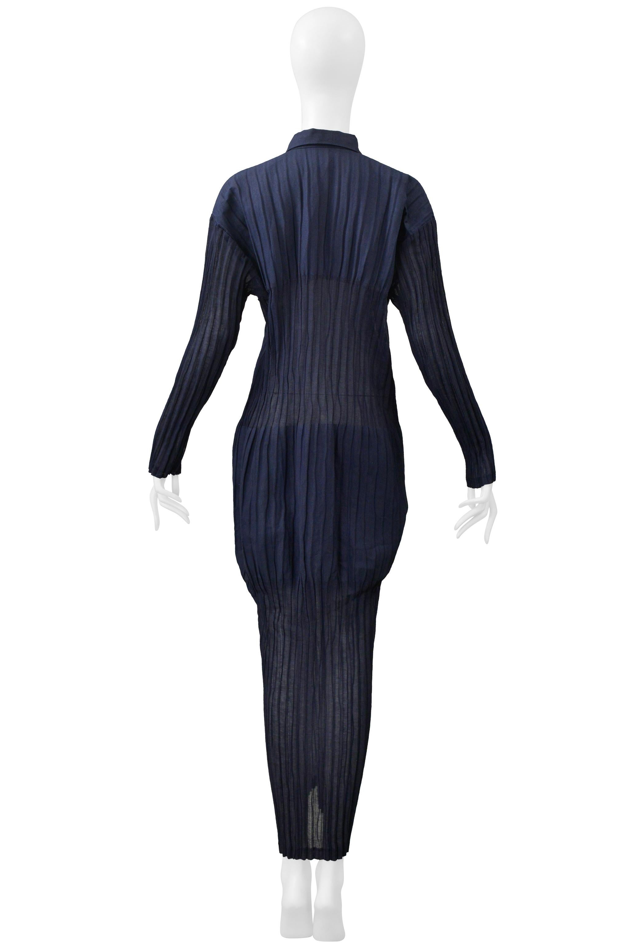 Resurrection Vintage is excited to present a vintage Issey Miyake indigo blue tubular pleated dress from the 1998 collection, featuring long sleeves, a folded 