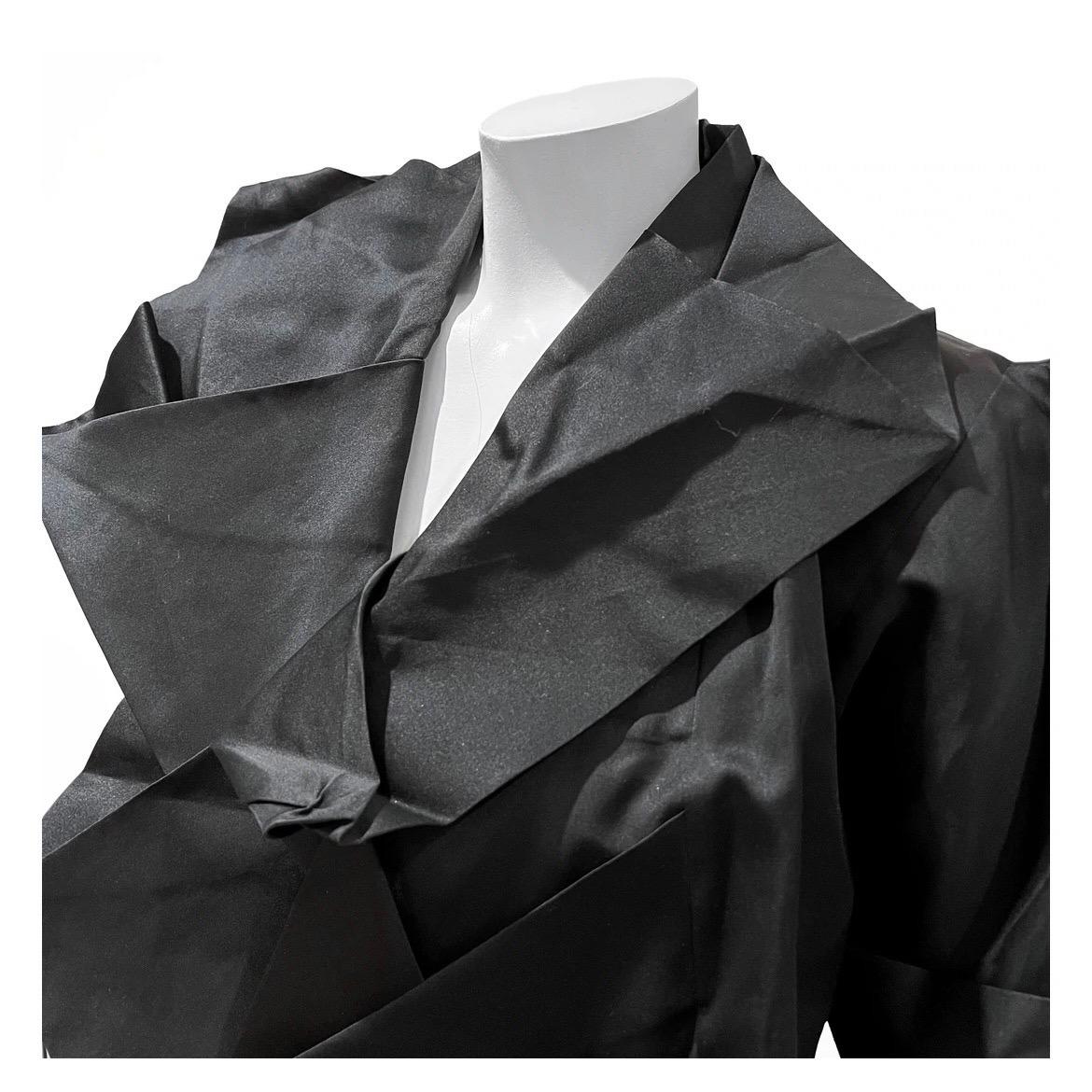 Vintage jacket by Issey Miyake 
1991
Made in Japan 
Black 
Pleated throughout 
Angled sleeves
100% silk 
Excellent vintage condition; some small snags but otherwise very little visual wear. 
Size/Measurements:
Size M
37