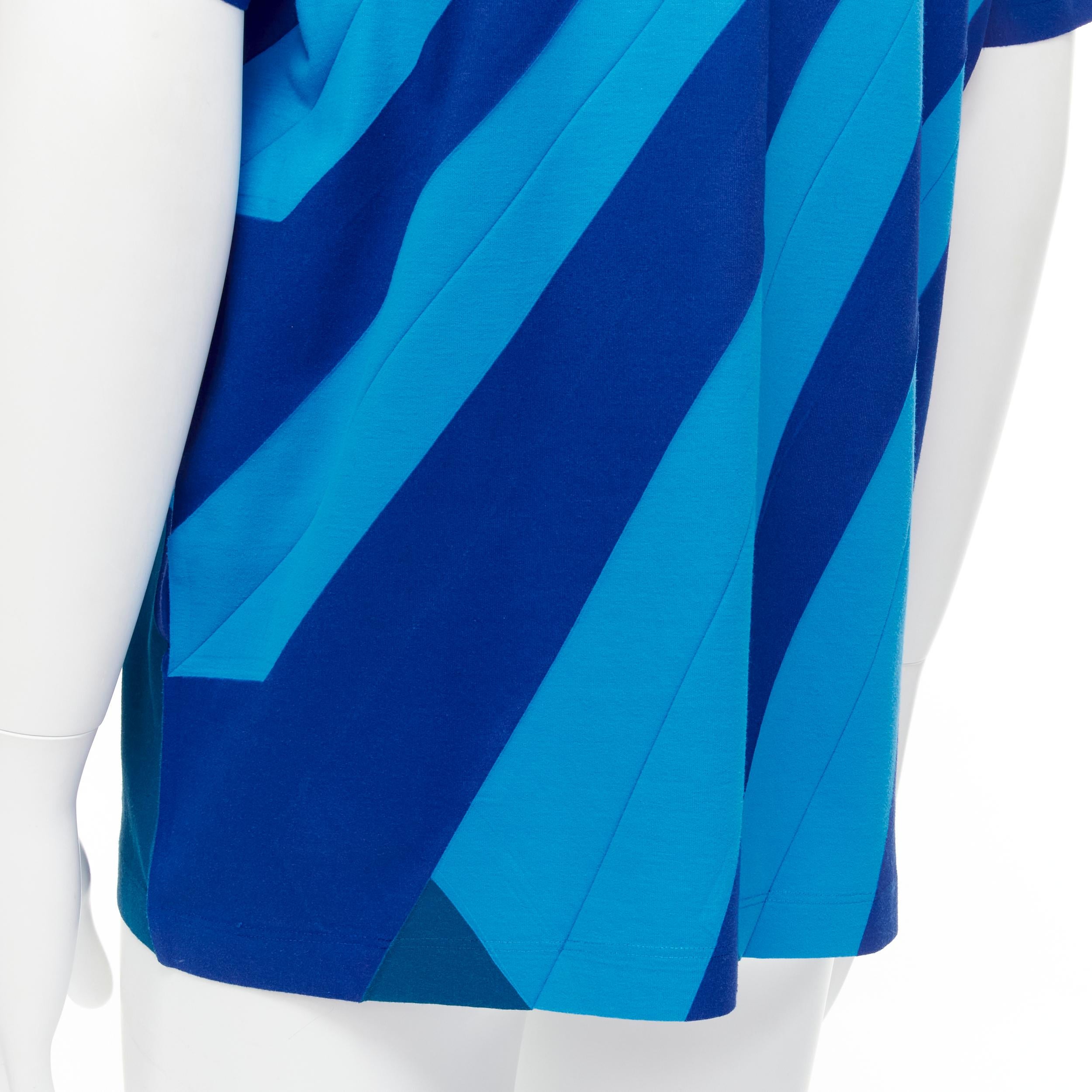 ISSEY MIYAKE MEN blue bonded pleat graphic print tshirt M 
Reference: INYG/A00010 
Brand: Issey Miyake Men 
Material: Cotton 
Color: Blue 
Pattern: Graphic 
Extra Detail: Graphic print with pleat. 
Estimated Retail Price: US $250 
Made in: Japan